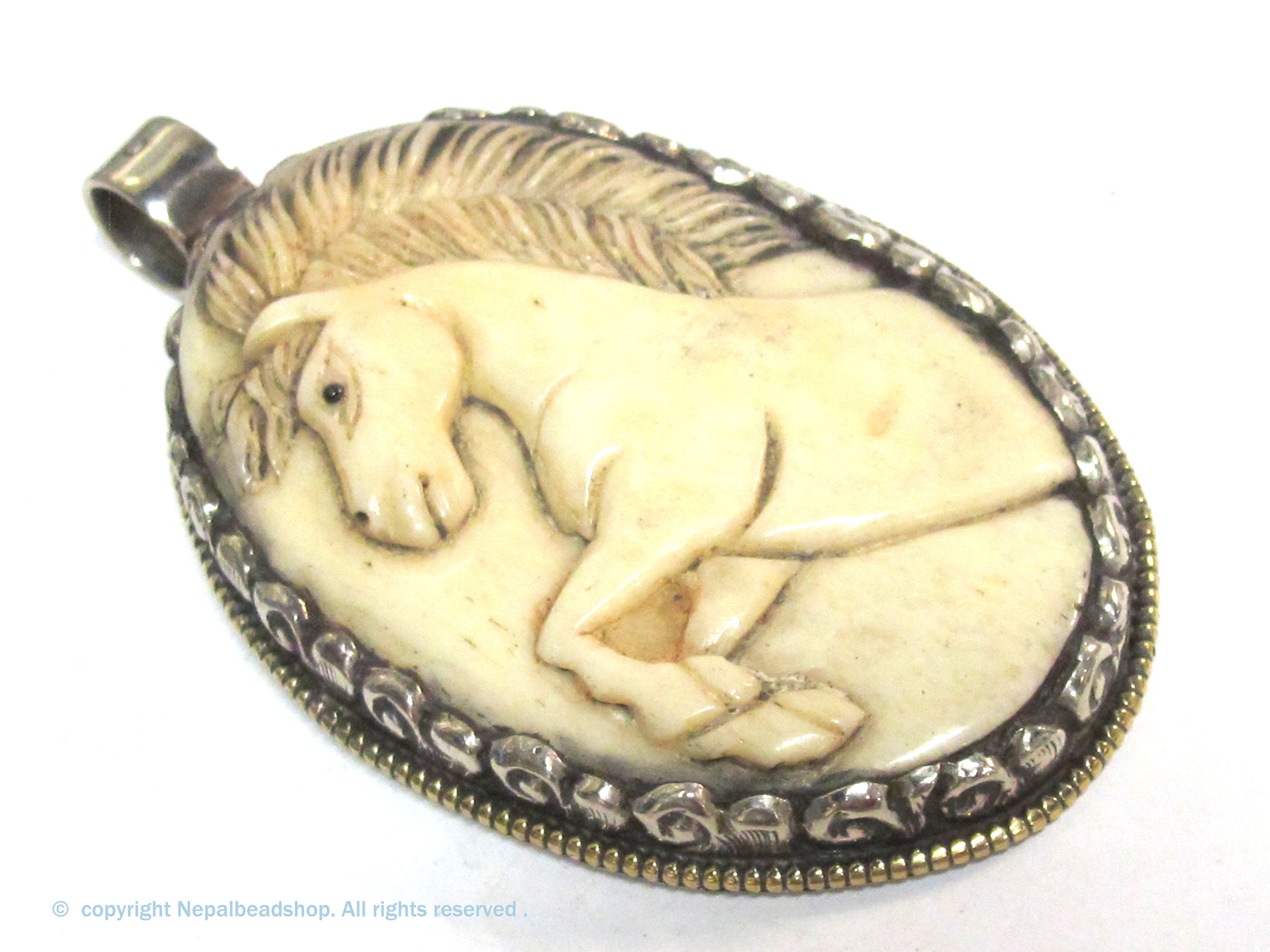 Unique large size carved cattle bone pendant with intricate unicorn horse design and floral carving on reverse side - PB008G