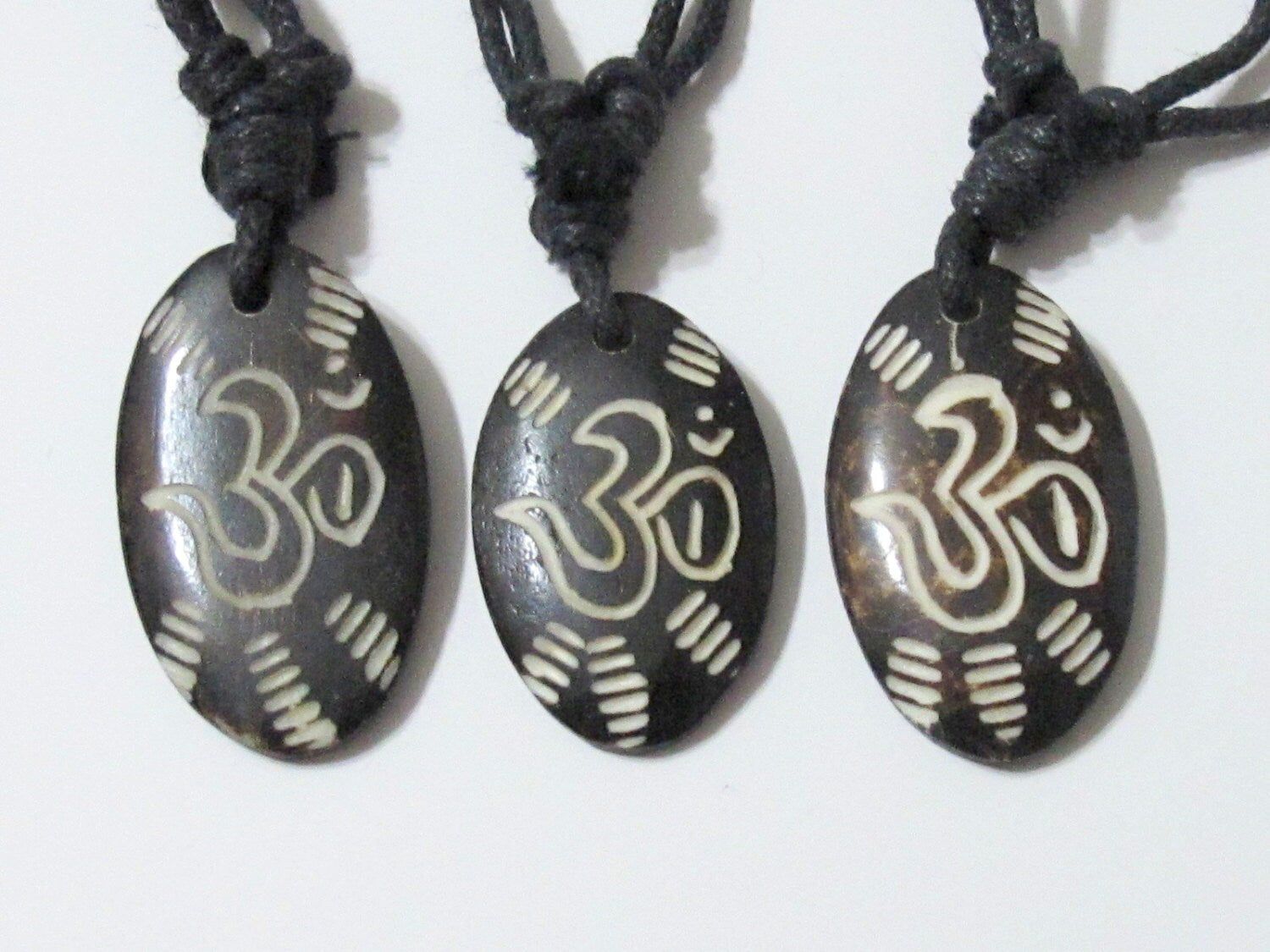 Carved OM bone pendant - PB006