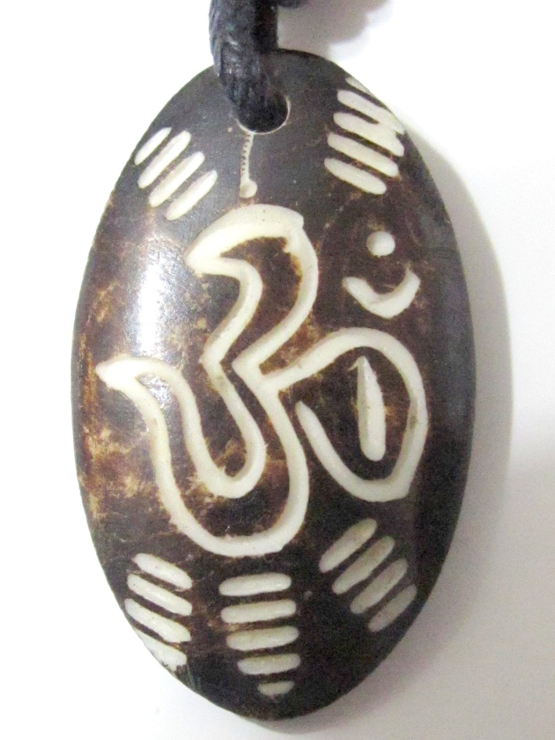 Carved OM bone pendant - PB006