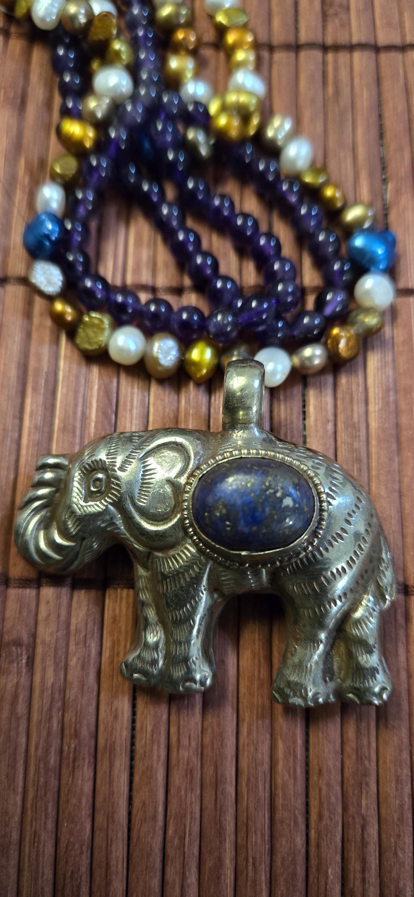Tibetan Elephant Pendant with lapis gemstone inlay | Repousse Jewelry from Nepal | Bold Animal pendant PM438J