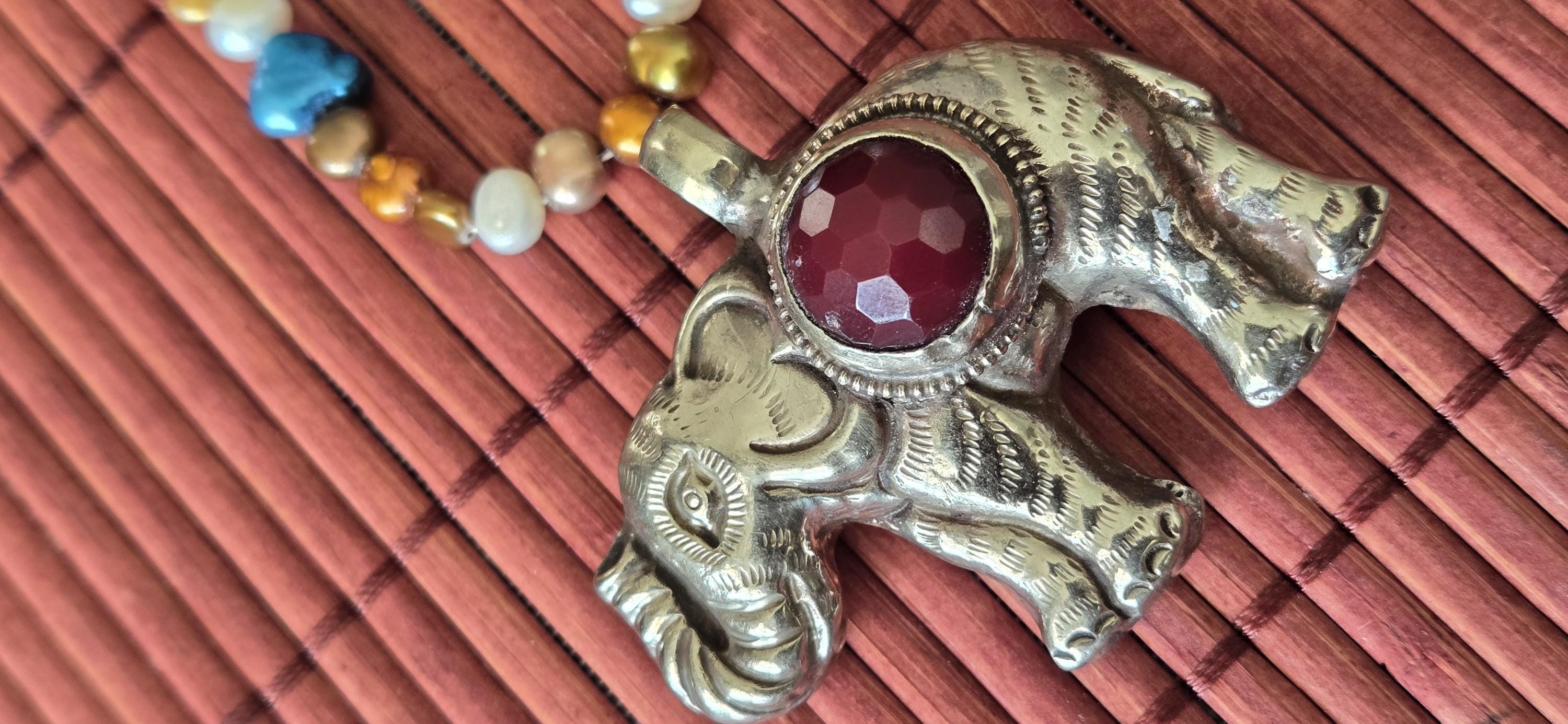 Tibetan Elephant Pendant with wine color faceted quartz gemstone inlay | Repousse Jewelry from Nepal | Bold Animal pendant PM438Q