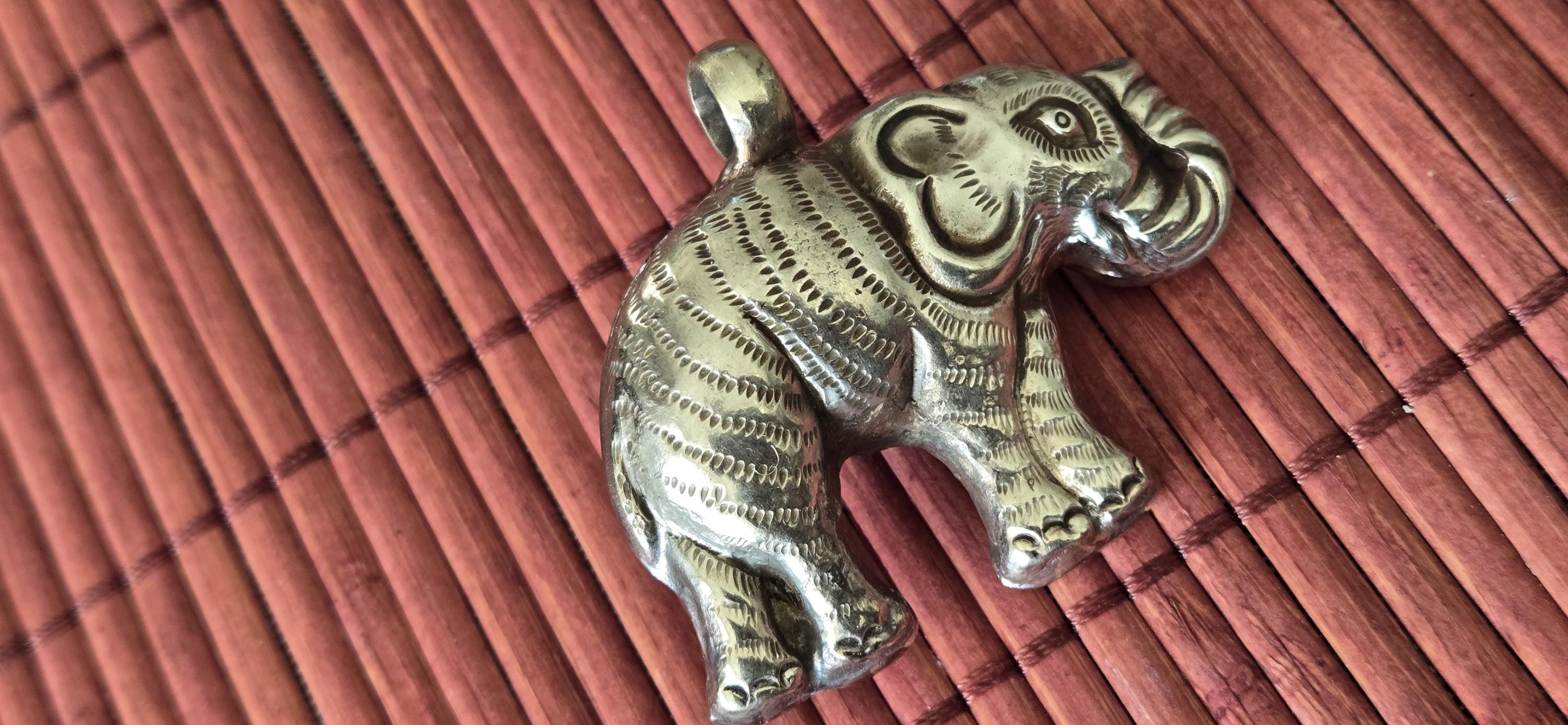 Tibetan Elephant Pendant with wine color faceted quartz gemstone inlay | Repousse Jewelry from Nepal | Bold Animal pendant PM438Q