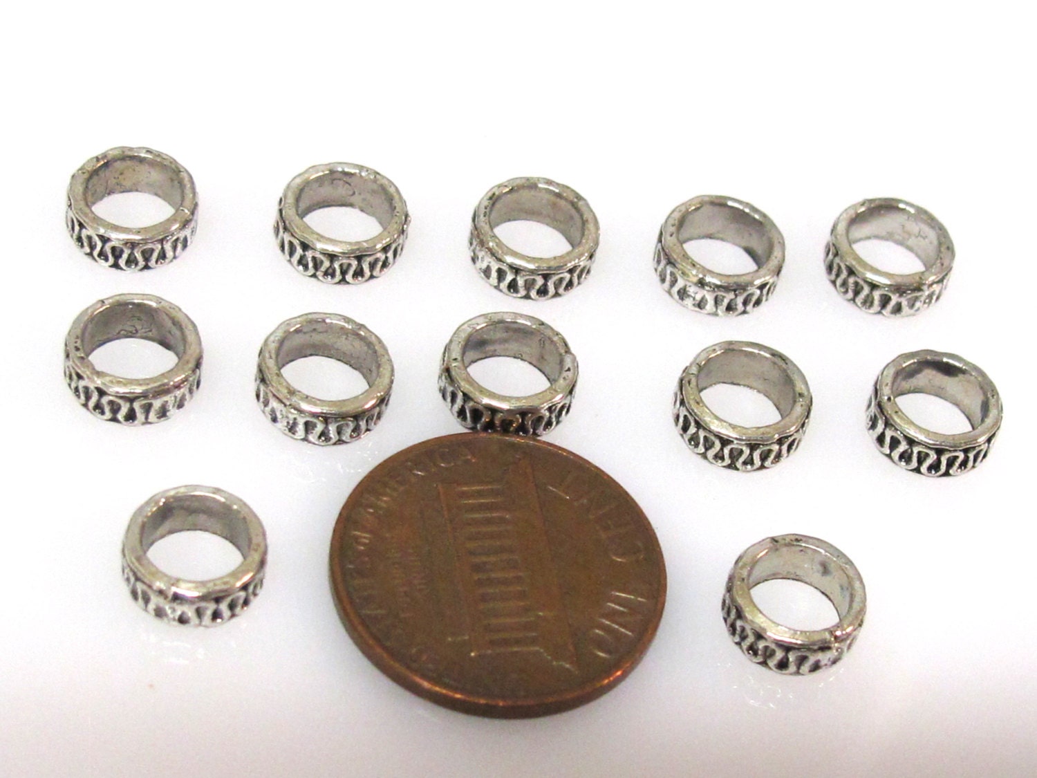 10 Beads - Antiqued silver tone metal alloy donut beads wavy design 8 mm wide x 4 mm - BD939