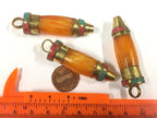 1 pendant - long Tibetan honey copal resin bullet shape pendant with brass cap and inlays - PM533