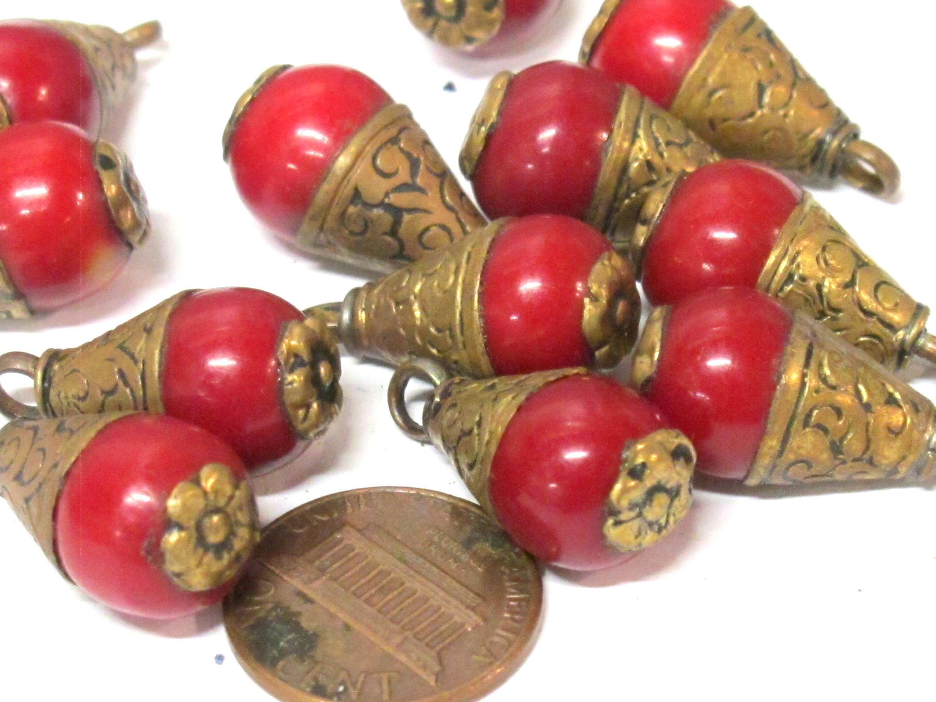 Tibetan brass capped red resin small size drop pendant with floral design on bail -- PM568A