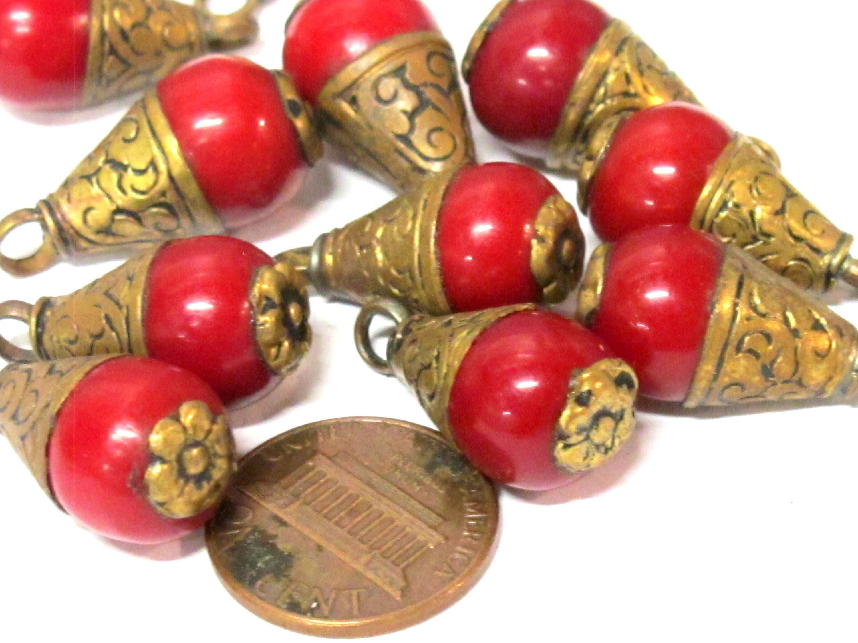 Tibetan brass capped red resin small size drop pendant with floral design on bail -- PM568A