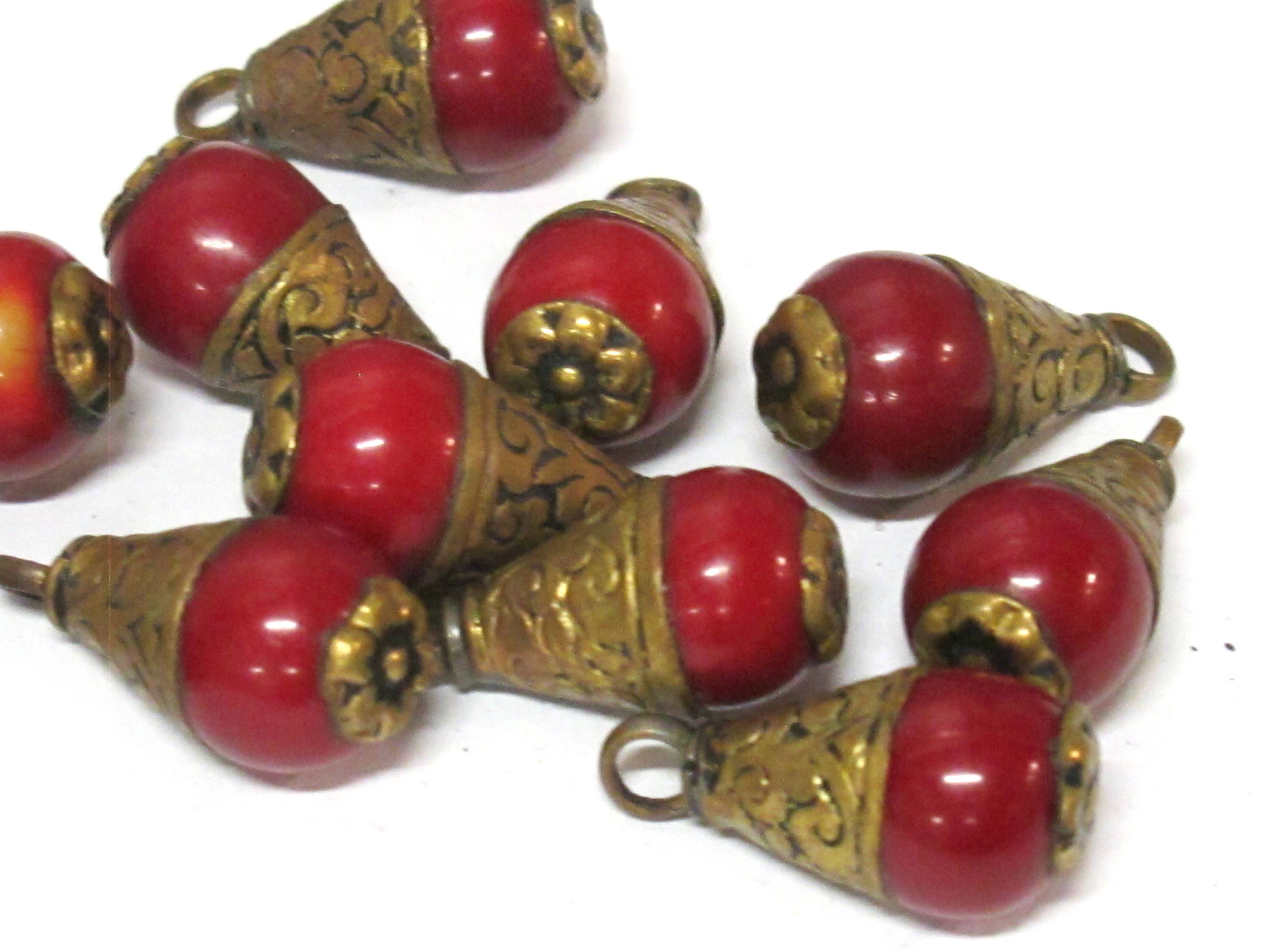 Tibetan brass capped red resin small size drop pendant with floral design on bail -- PM568A