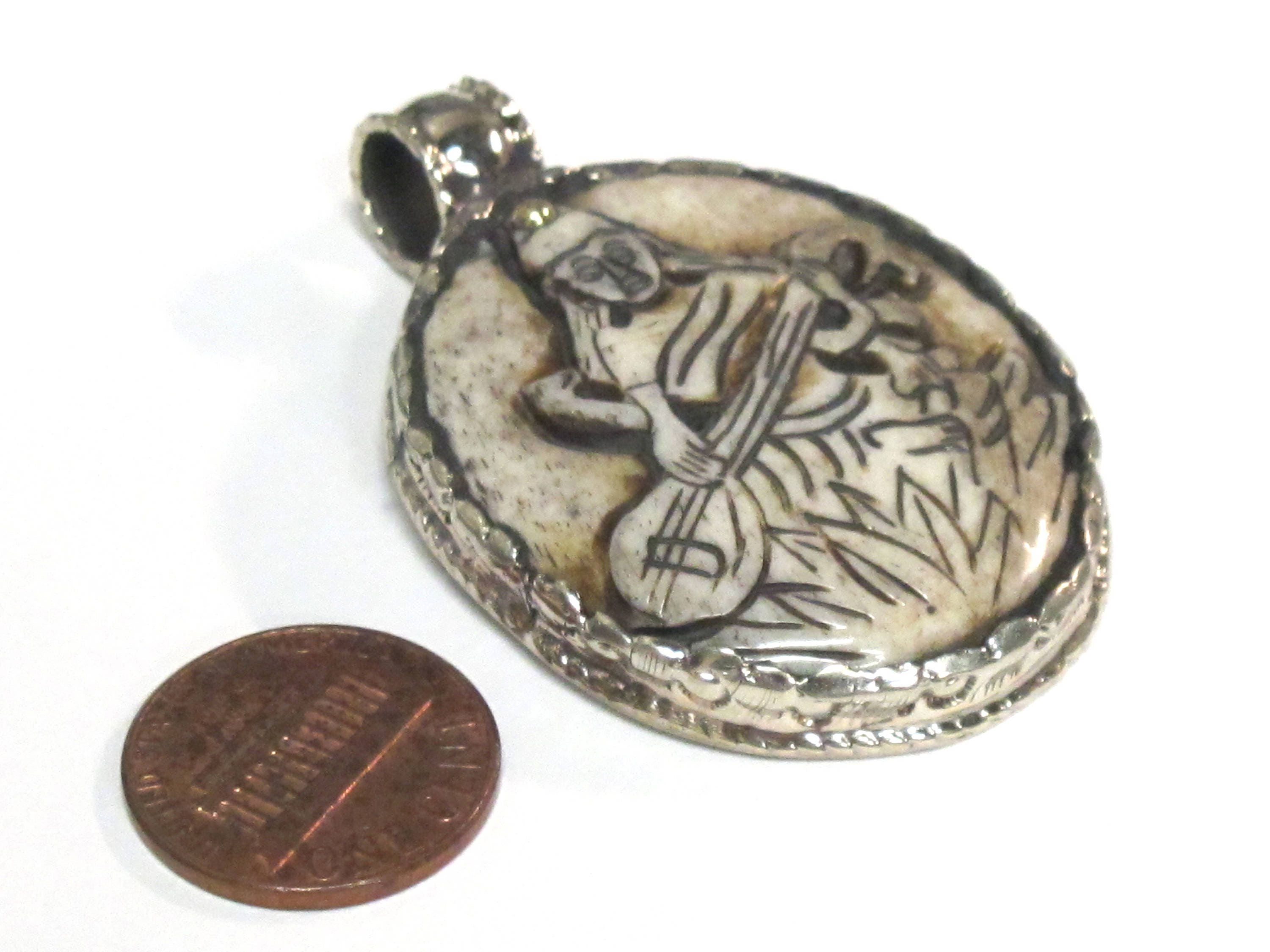 1 Pendant - Intricate carved ethnic Hindu Goddess Saraswati Maa recycled cattle bone pendant with floral carving on reverse side - PB007K