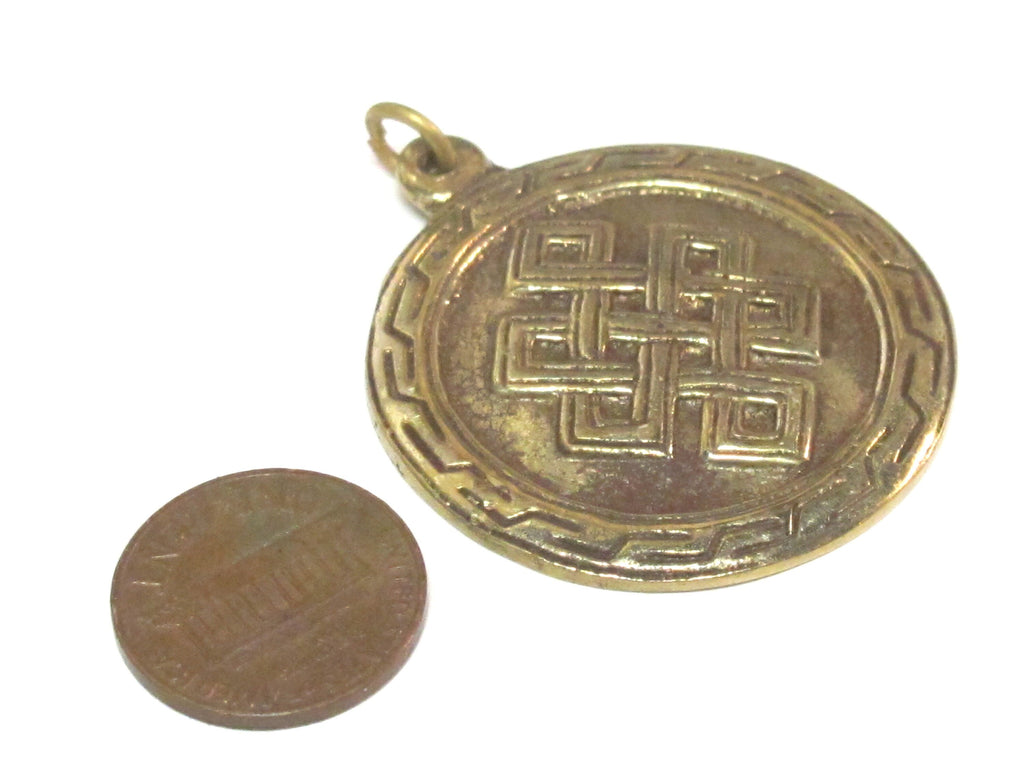 1 Pendant - Tibetan brass infinity knot endless knot symbol with reverse side om mantra pendant from Nepal - CP139