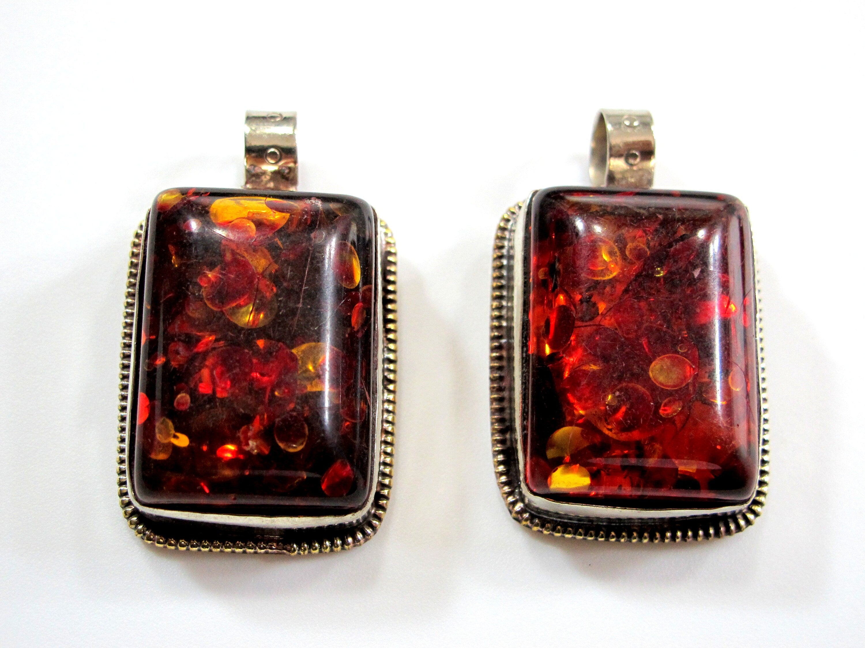 Beautiful Tibetan honey color resin pendant with floral design on reverse side Tibetan pendant Nepal jewelry supply nepalbeadshop PM704A