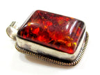 Beautiful Tibetan honey color resin pendant with floral design on reverse side Tibetan pendant Nepal jewelry supply nepalbeadshop PM704A