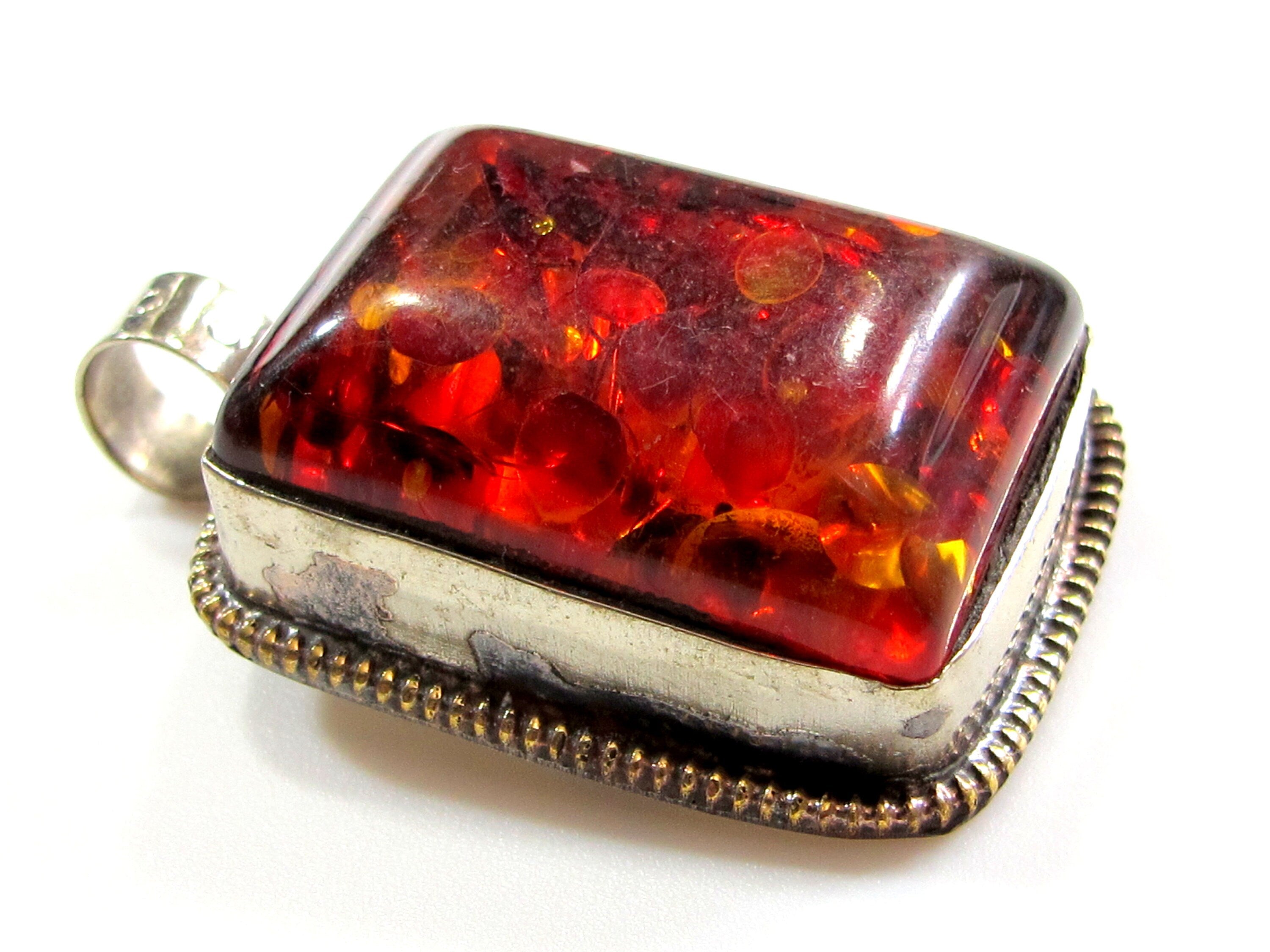 Beautiful Tibetan honey color resin pendant with floral design on reverse side Tibetan pendant Nepal jewelry supply nepalbeadshop PM704A