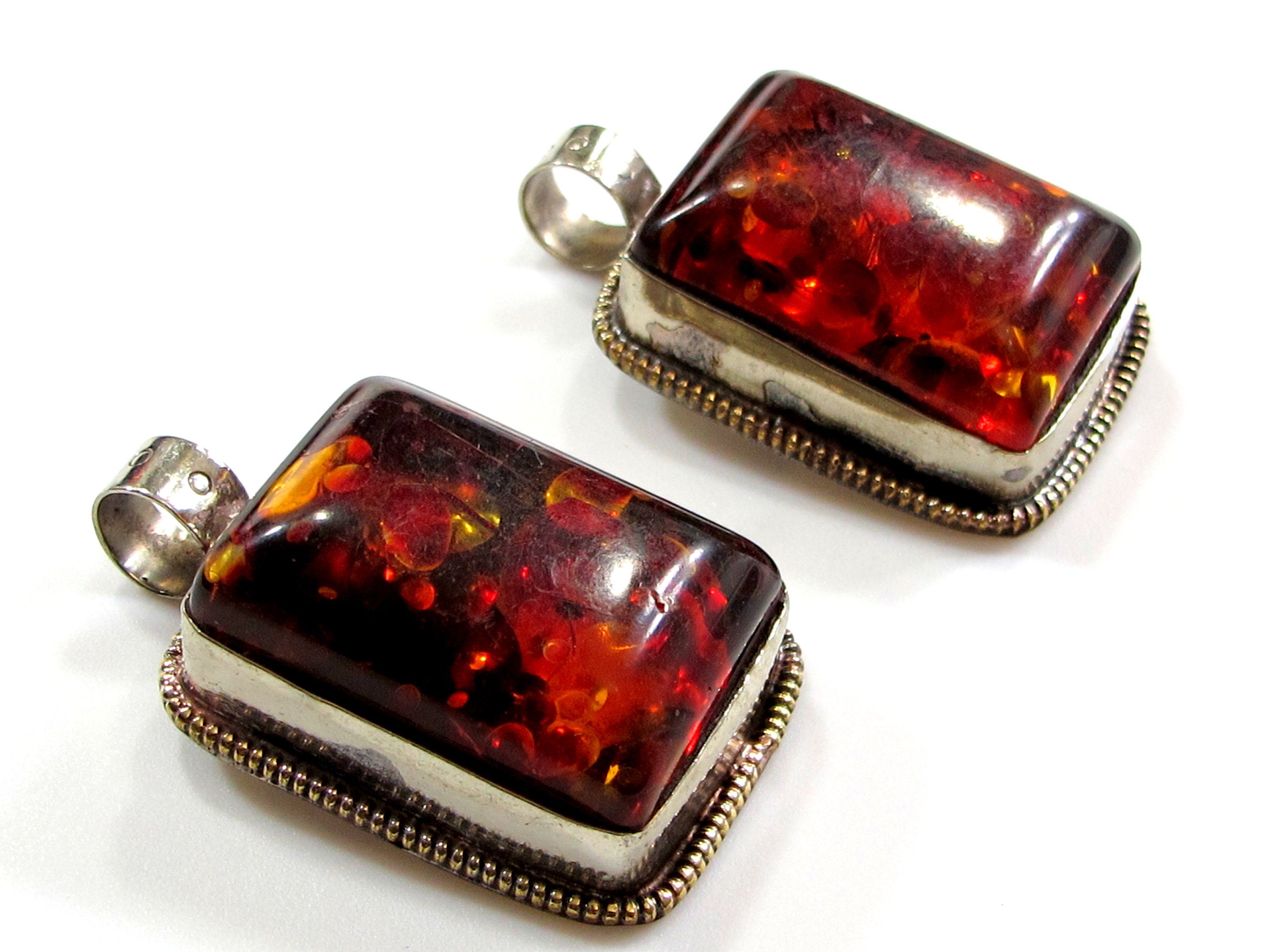 Beautiful Tibetan honey color resin pendant with floral design on reverse side Tibetan pendant Nepal jewelry supply nepalbeadshop PM704A