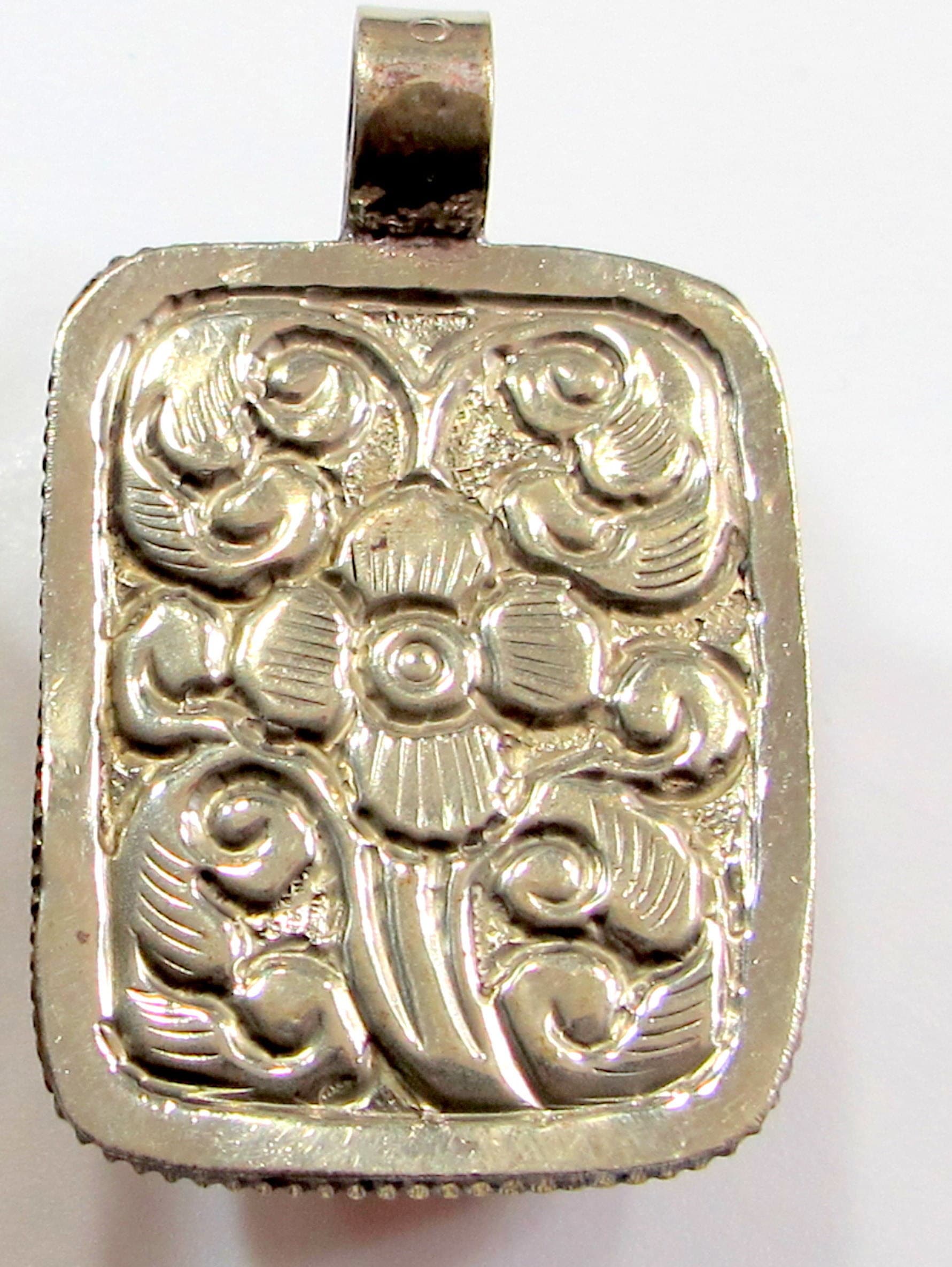 Beautiful Tibetan honey color resin pendant with floral design on reverse side Tibetan pendant Nepal jewelry supply nepalbeadshop PM704A
