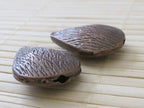 2 pieces - Teardrop shape copper tone beads - BD201