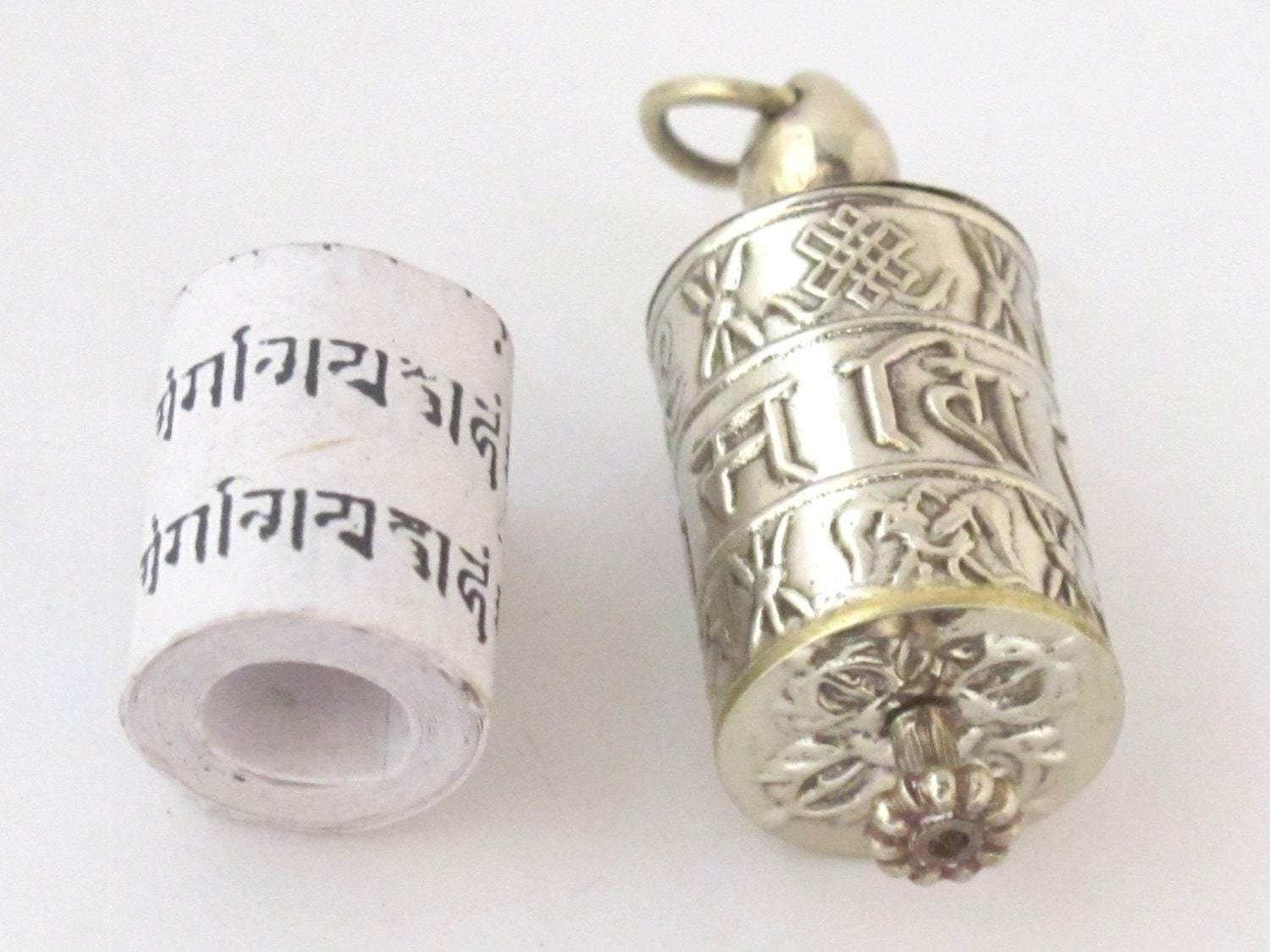 Tibetan antiqued silver Om Mantra with auspicious symbols spinnable prayer wheel scroll pendant light-weight Nepal - SP022