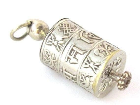 Tibetan antiqued silver Om Mantra with auspicious symbols spinnable prayer wheel scroll pendant light-weight Nepal - SP022