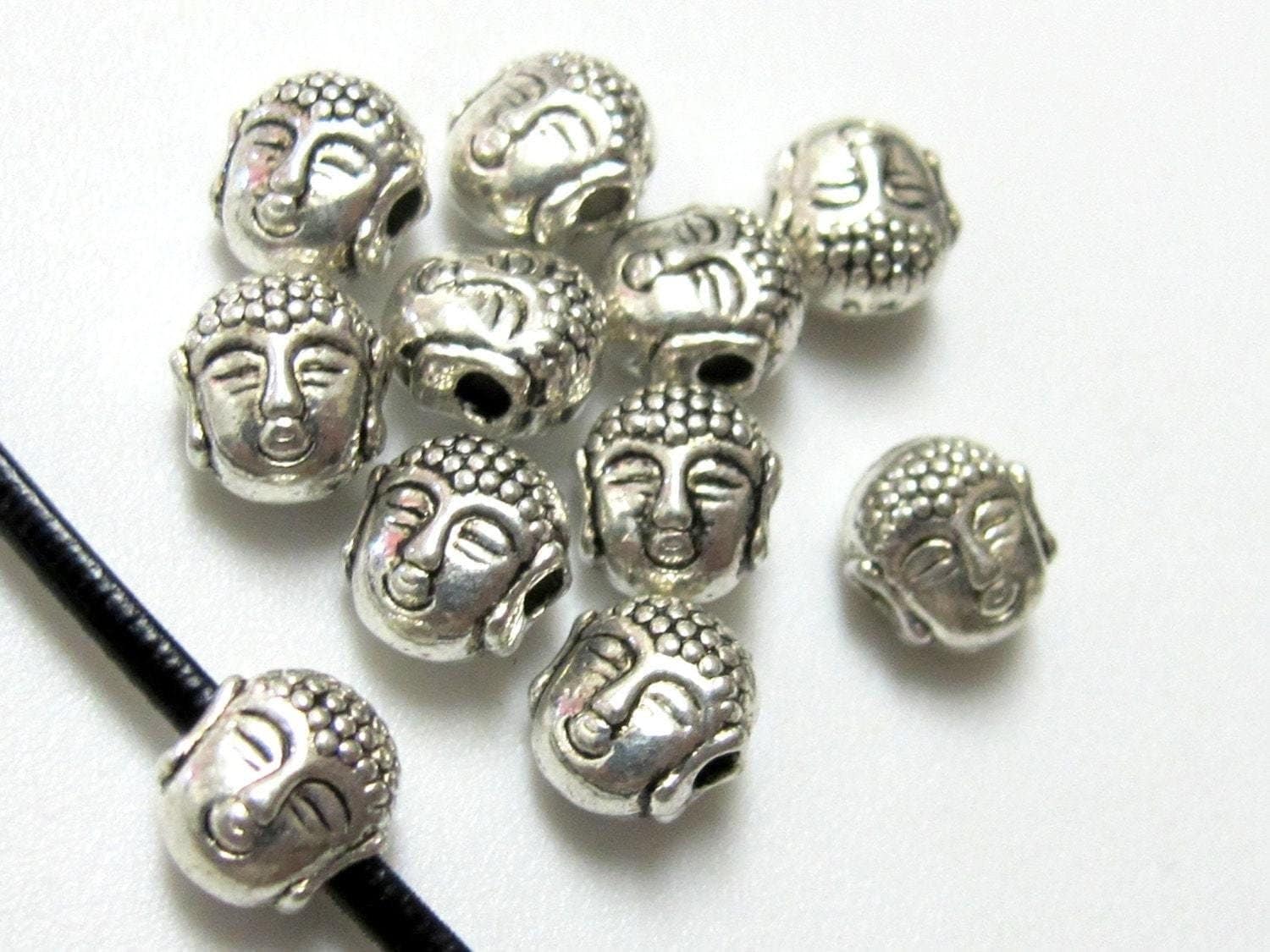 10 Beads - Dual sided Tibetan Buddha bead - BD386