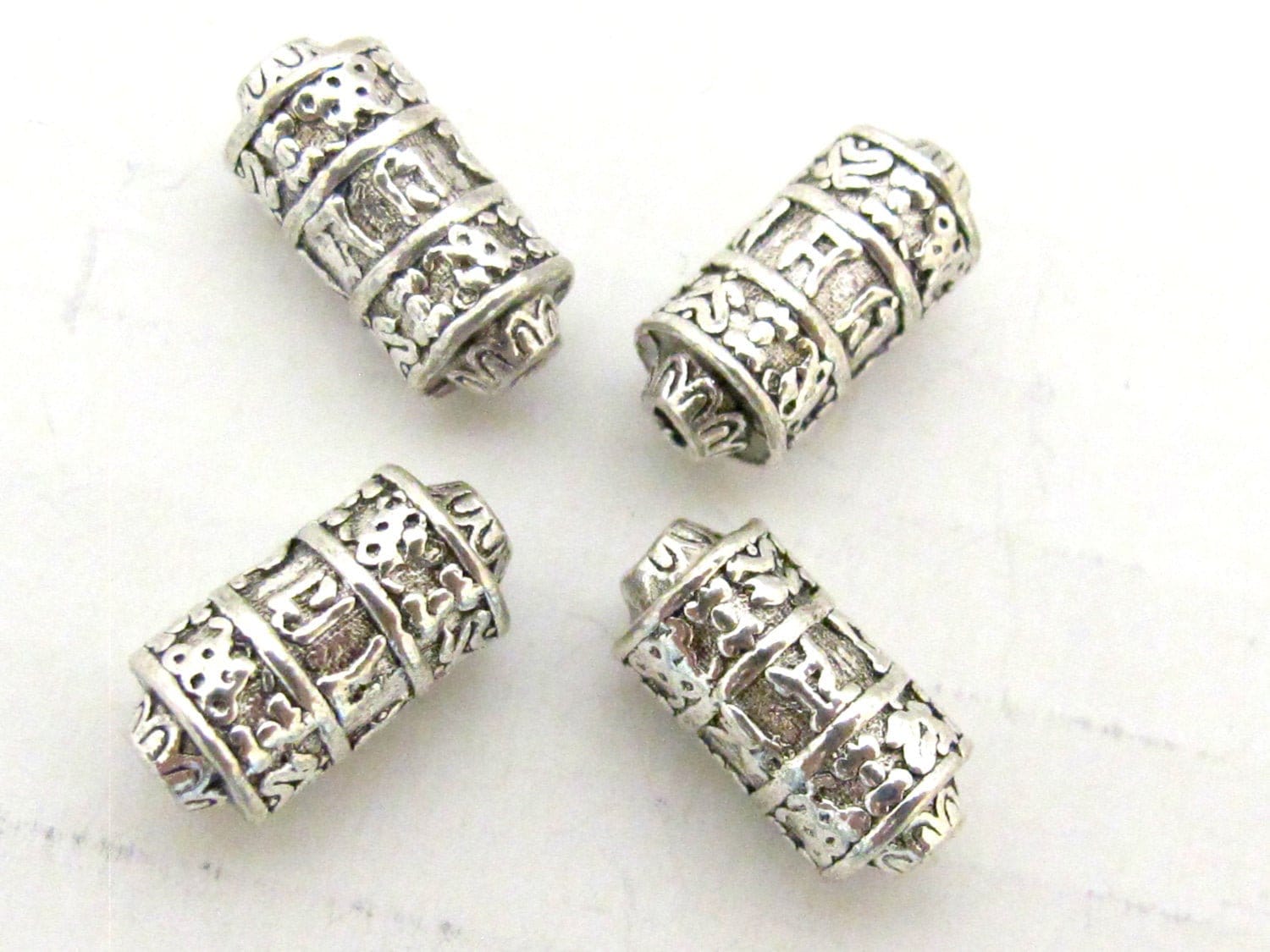 4 BEADS - Tibetan om mantra ashtamangala symbols scroll shape silver tone metal beads 15 mm x 7 mm - BD788