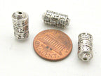 4 BEADS - Tibetan om mantra ashtamangala symbols scroll shape silver tone metal beads 15 mm x 7 mm - BD788