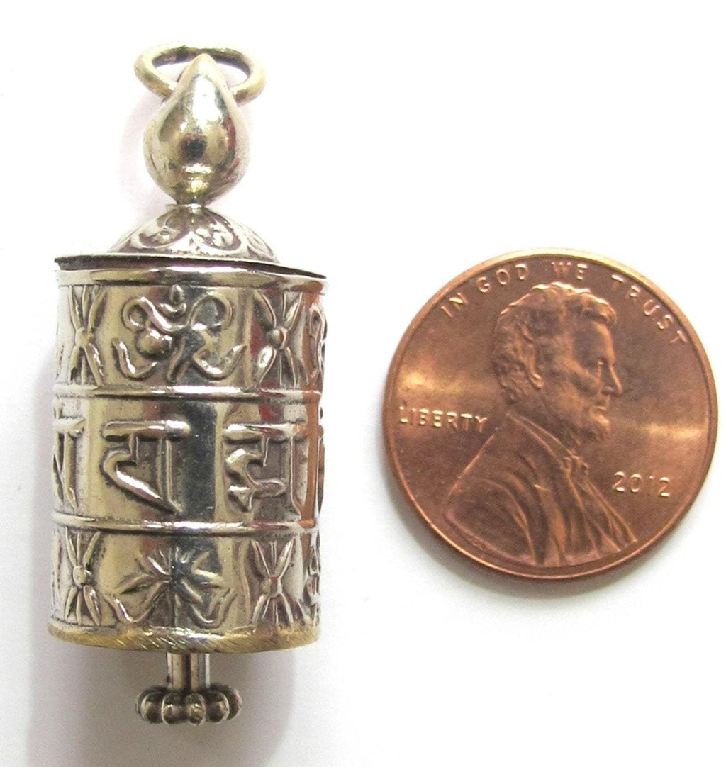 Tibetan antiqued silver Om Mantra with auspicious symbols spinnable prayer wheel scroll pendant light-weight Nepal - SP022