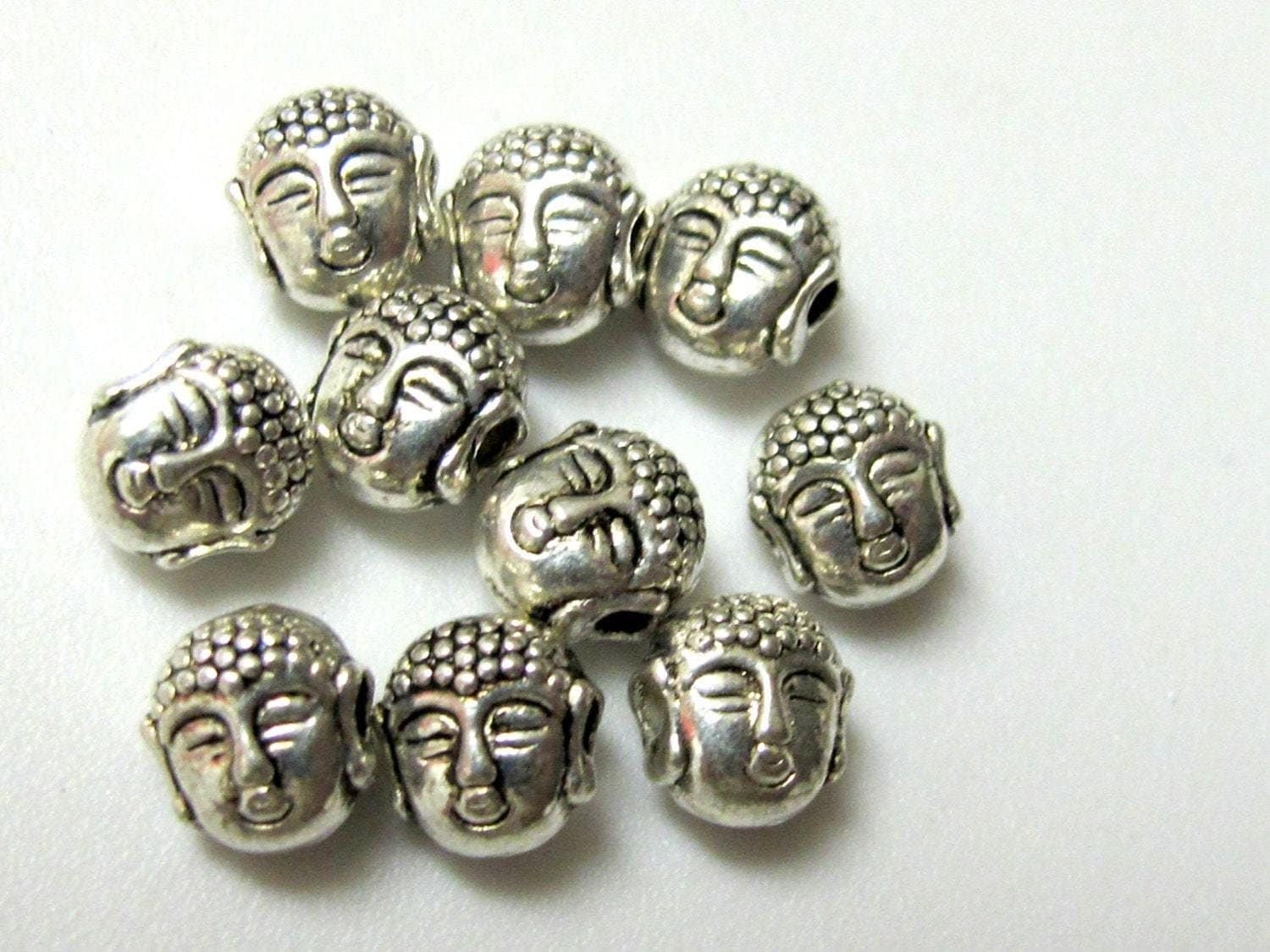 10 Beads - Dual sided Tibetan Buddha bead - BD386