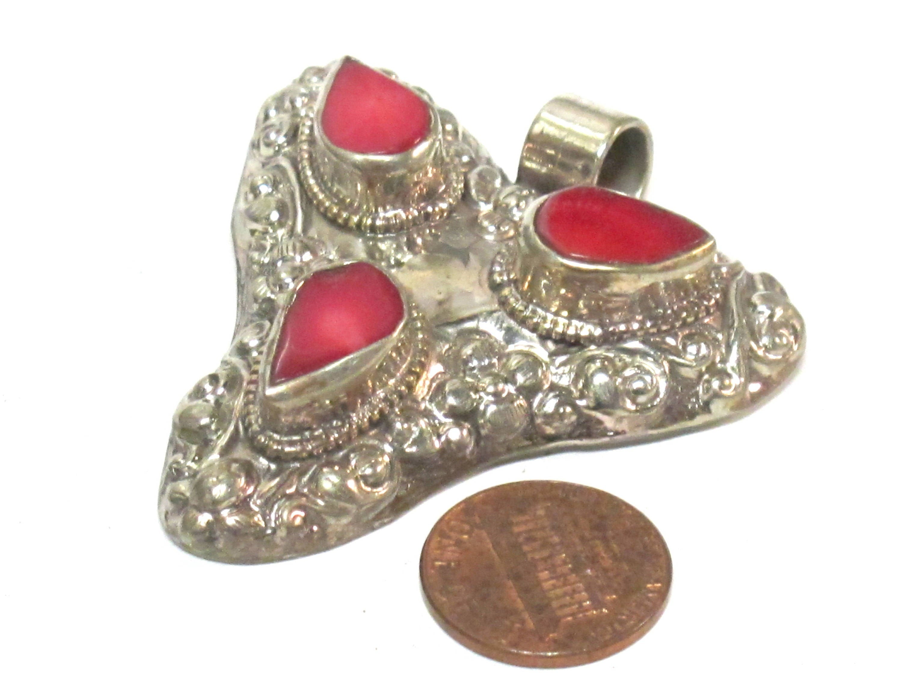 1 Pendant - Ethnic Tibetan triangular arrowhead shape coral inlaid pendant from Nepal with floral fish carving on reverse side - PM585B