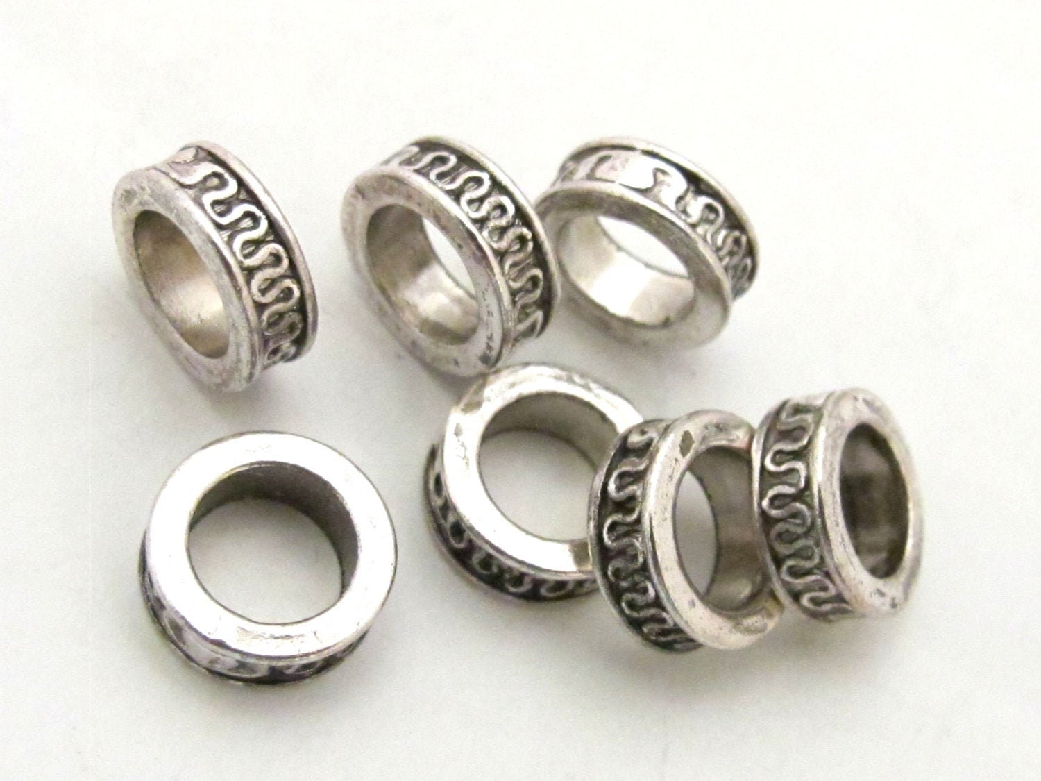 8 Beads - Antiqued silver tone metal alloy donut beads wavy design 11 mm wide x 4 mm - BD785