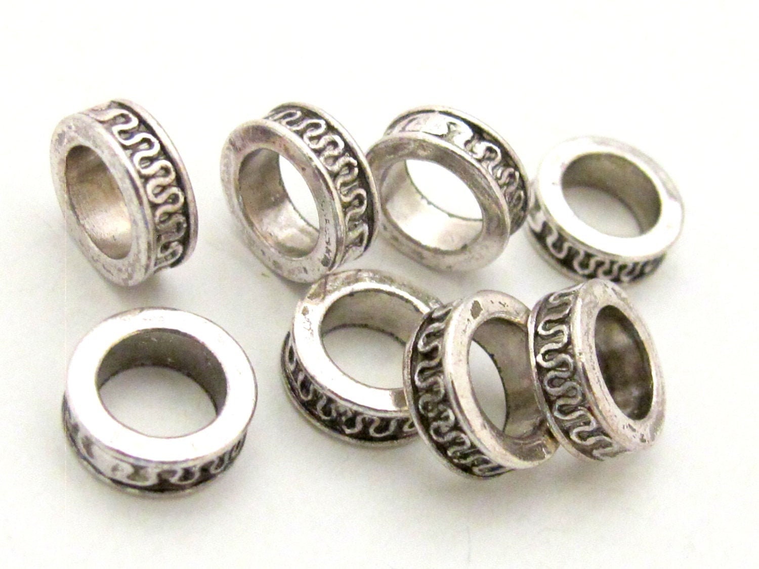 8 Beads - Antiqued silver tone metal alloy donut beads wavy design 11 mm wide x 4 mm - BD785