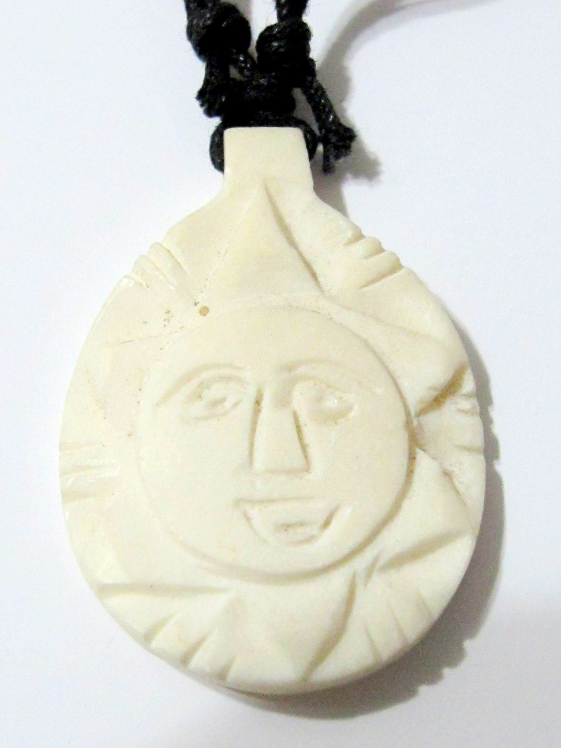 Cream color carved face recycled cattle bone pendant from Nepal - PB015