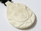 Cream color carved face recycled cattle bone pendant from Nepal - PB015