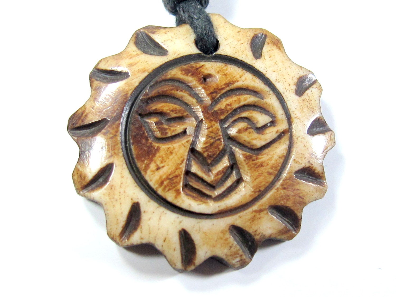 This is a round sun face recycled cattle bone pendant - PB031