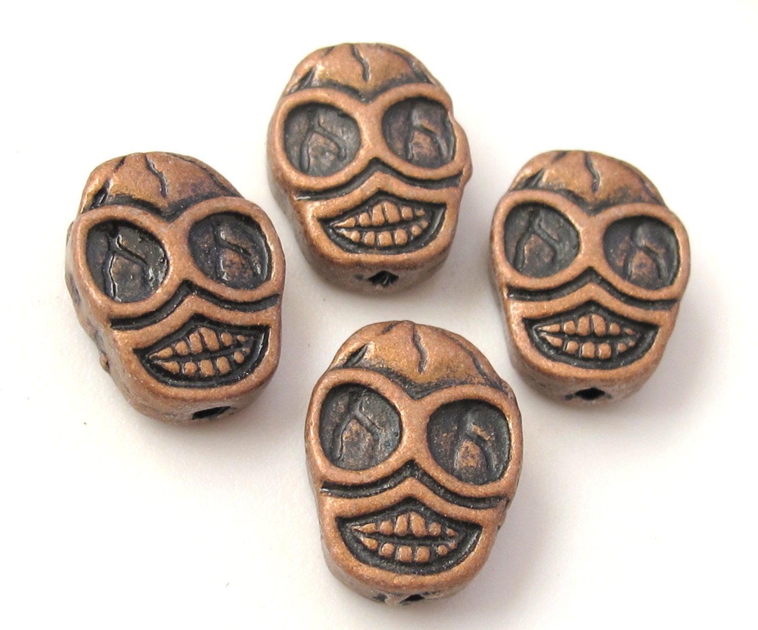 4 beads - Copper tone finish metal skull beads - BD352