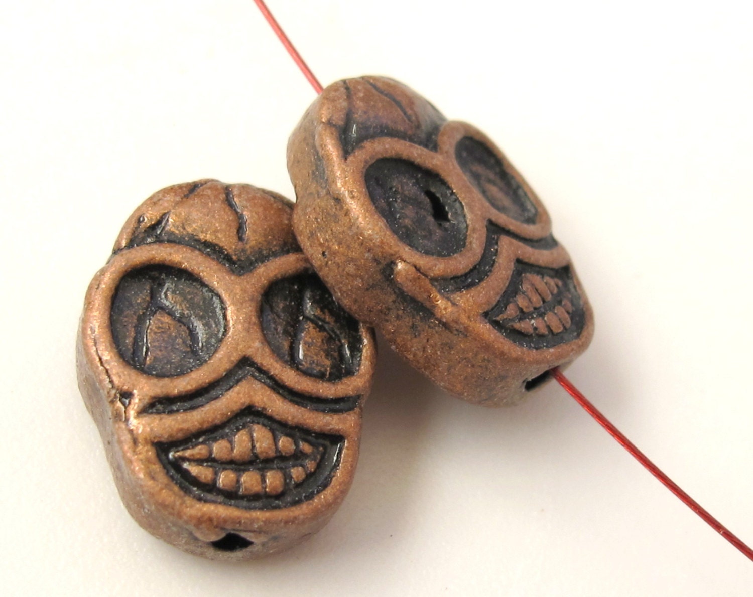 4 beads - Copper tone finish metal skull beads - BD352