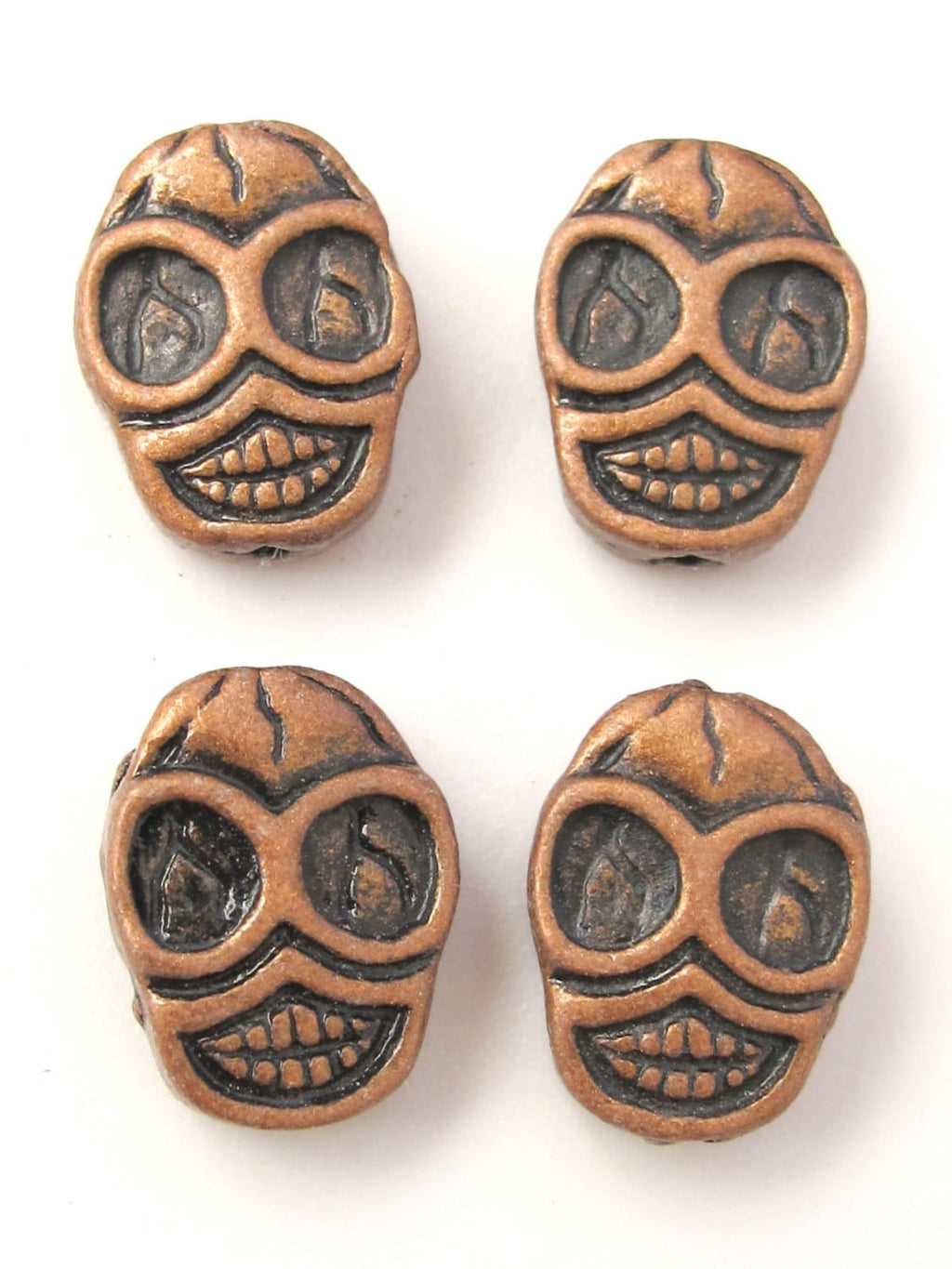 4 beads - Copper tone finish metal skull beads - BD352