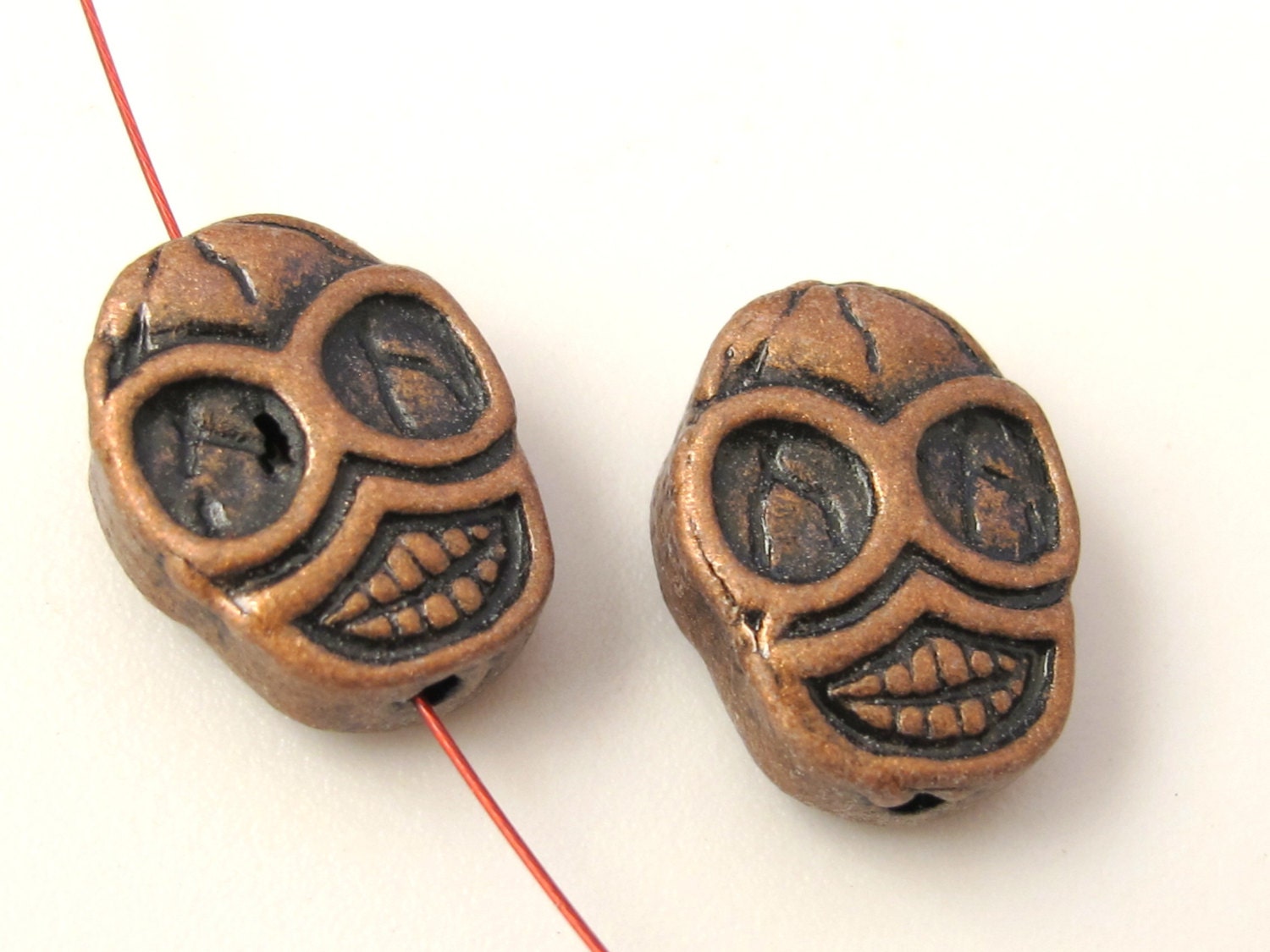 4 beads - Copper tone finish metal skull beads - BD352