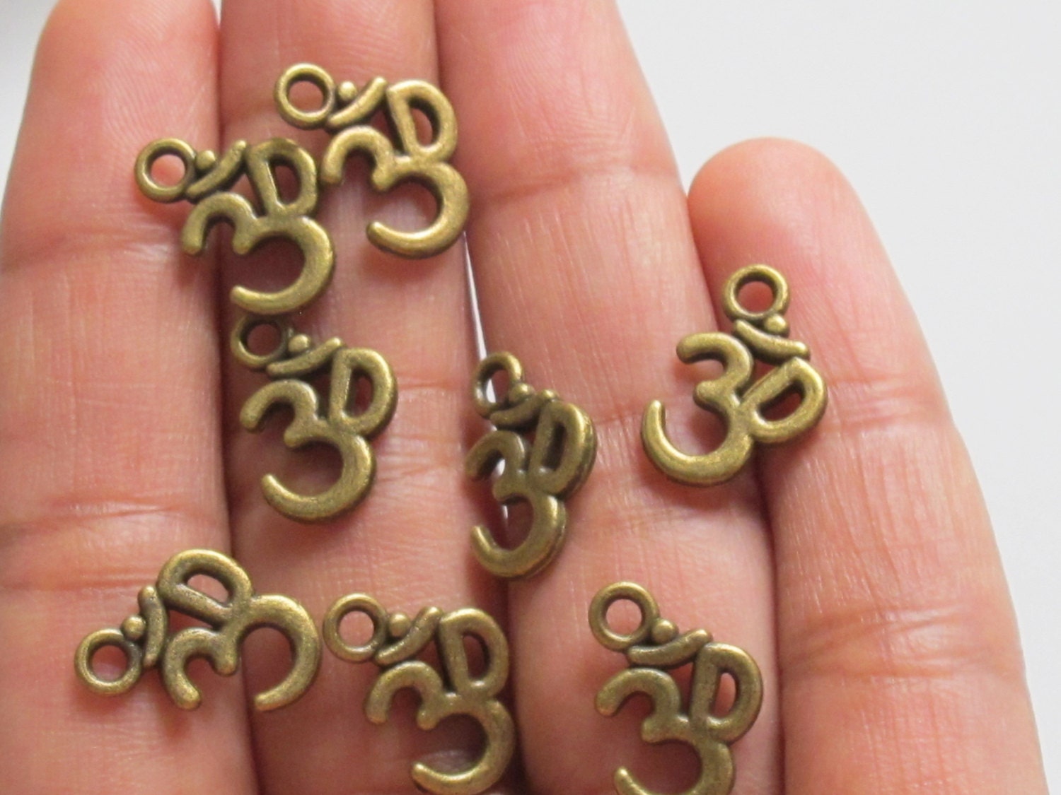 Brass tone yoga meditation om metal charms beads - 10 pieces - BD329