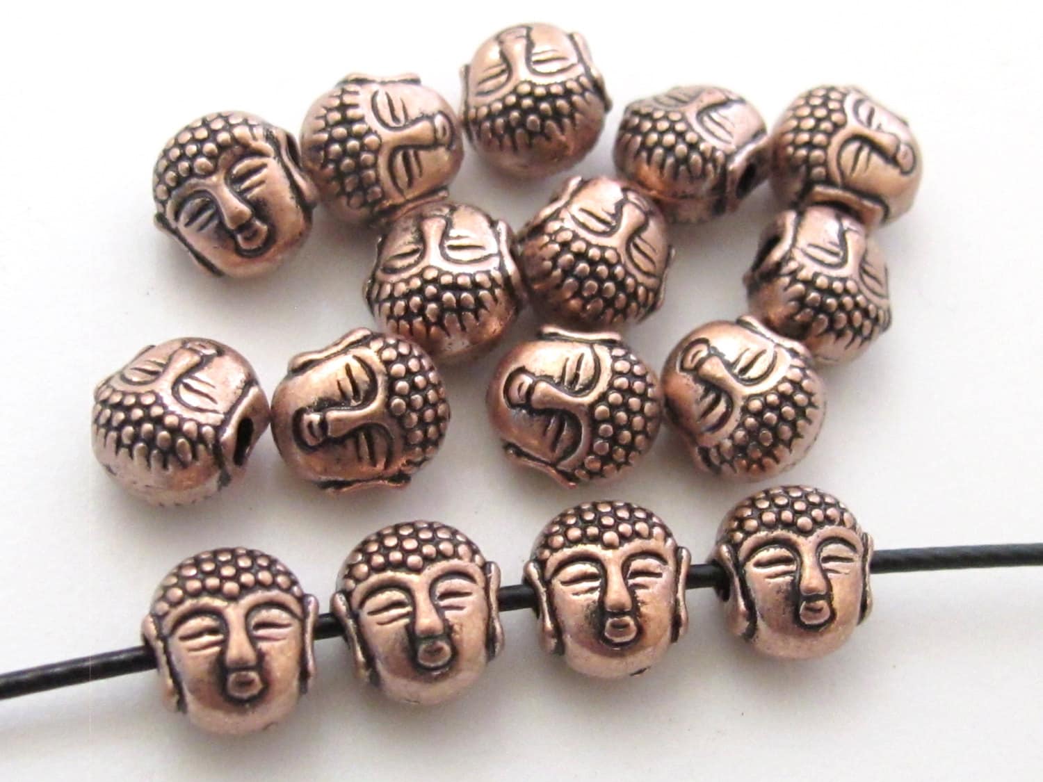Small size reversible Tibetan Buddha copper tone color metal beads - 4 beads - BD422