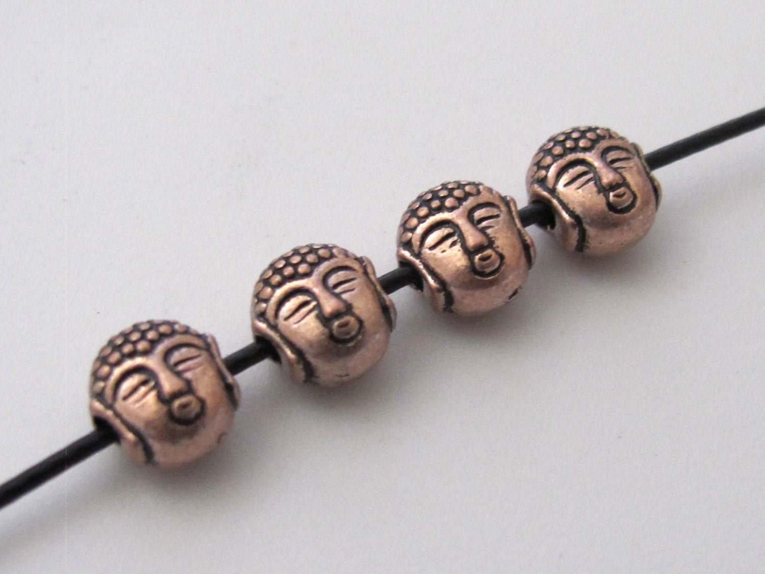 Small size reversible Tibetan Buddha copper tone color metal beads - 4 beads - BD422