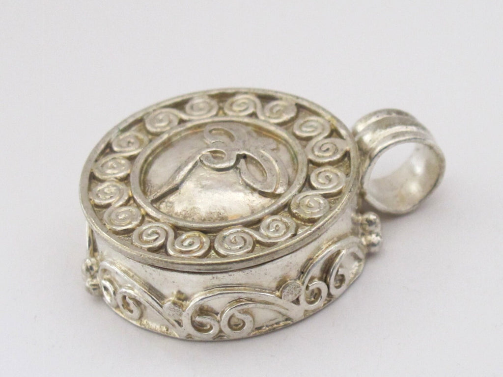 Round shape Tibetan antiqued silver finish Ghau prayer box pendant with buddha eyes symbol and double spiral design - PM191H