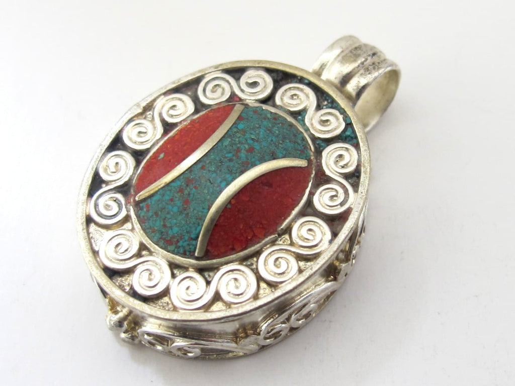 Oval shape Tibetan silver finish Ghau prayer box pendant with turquoise coral inlay and double spiral design - PM191E