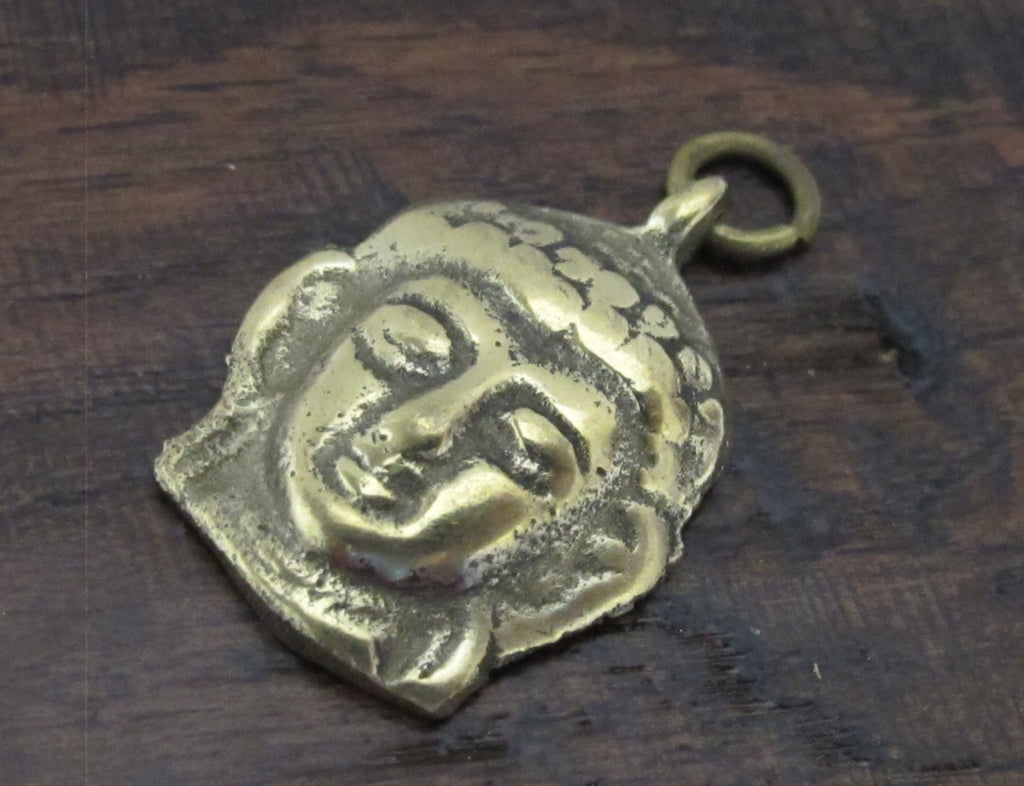 Tibetan Buddha face pendant from Nepal - CP043