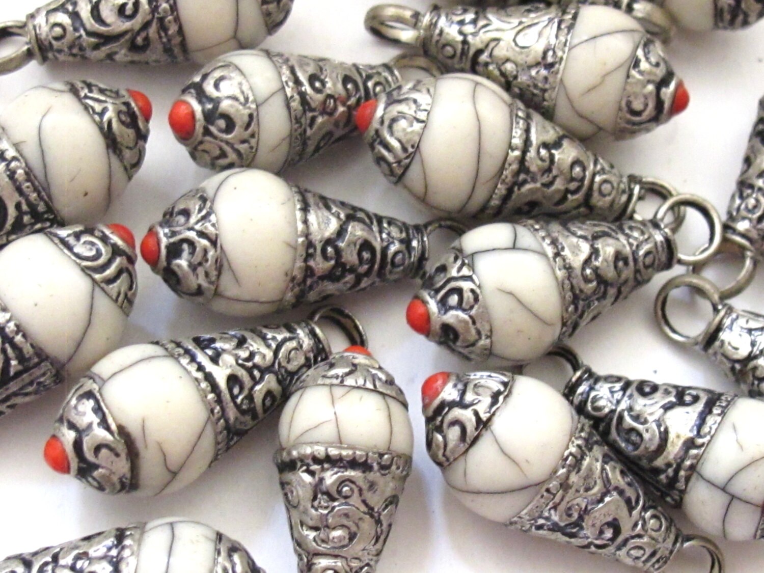 Tibetan silver cream white crackle resin small size pendant with floral design on bail - PM209E