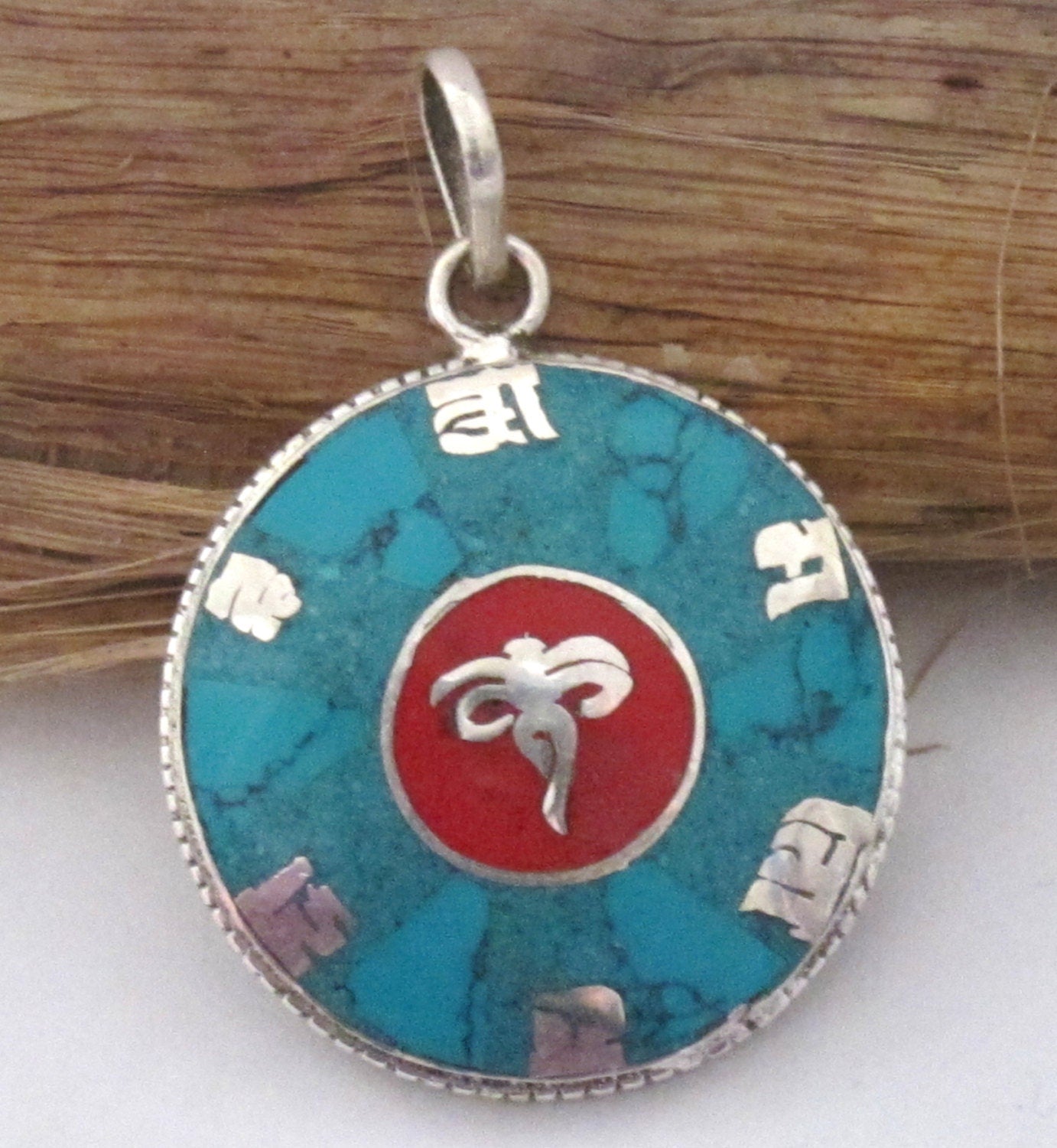 Tibetan silver om Buddha eye pendant with turquoise inlay - PM220G