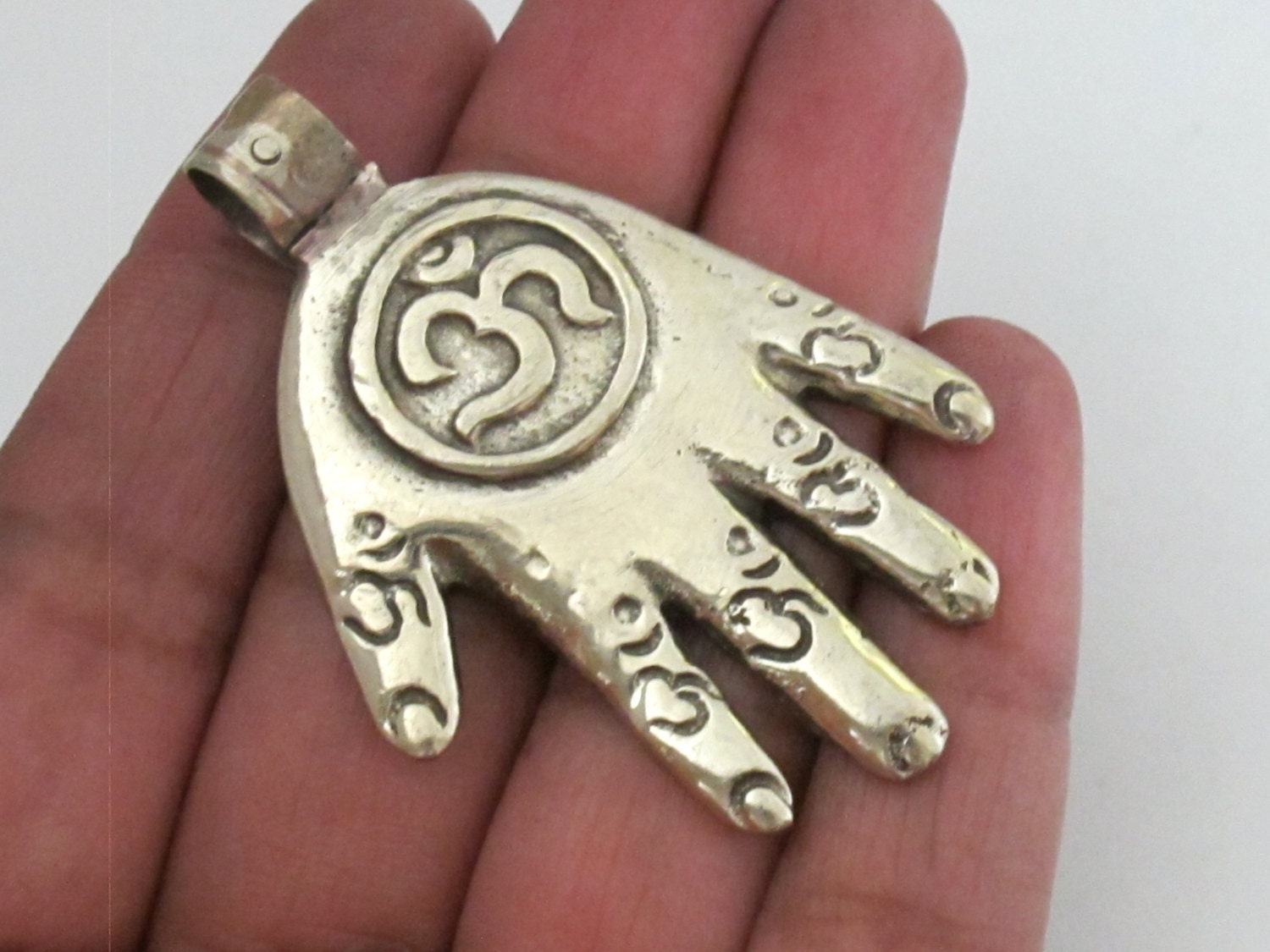 Reversible Tibetan silver Buddha hand Om pendant with Lotus floral details on the reverse side - PM233C