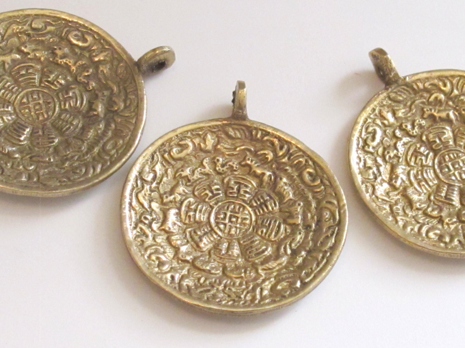 Tibetan Om with calendar timeline wheel Solid Brass pendant 50 mm height x 43 mm wide - CP051 custom design copyright Nepalbeadshop