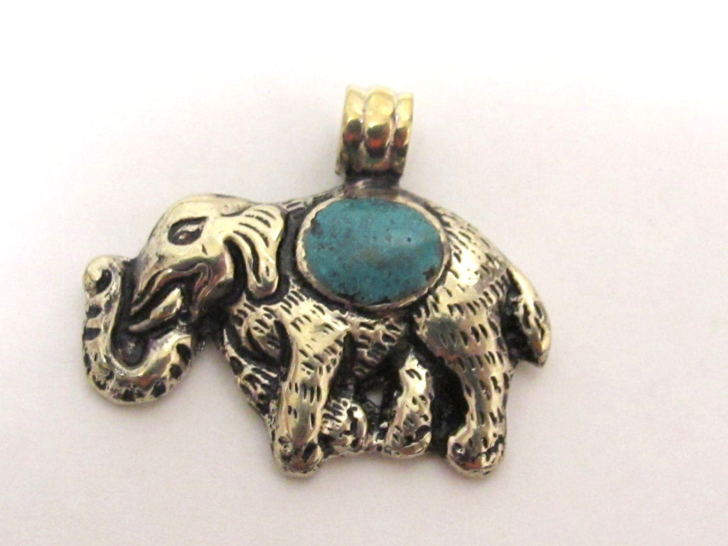 Small Elephant shape reversible Tibetan repousse pendant with turquoise inlay - PM254B