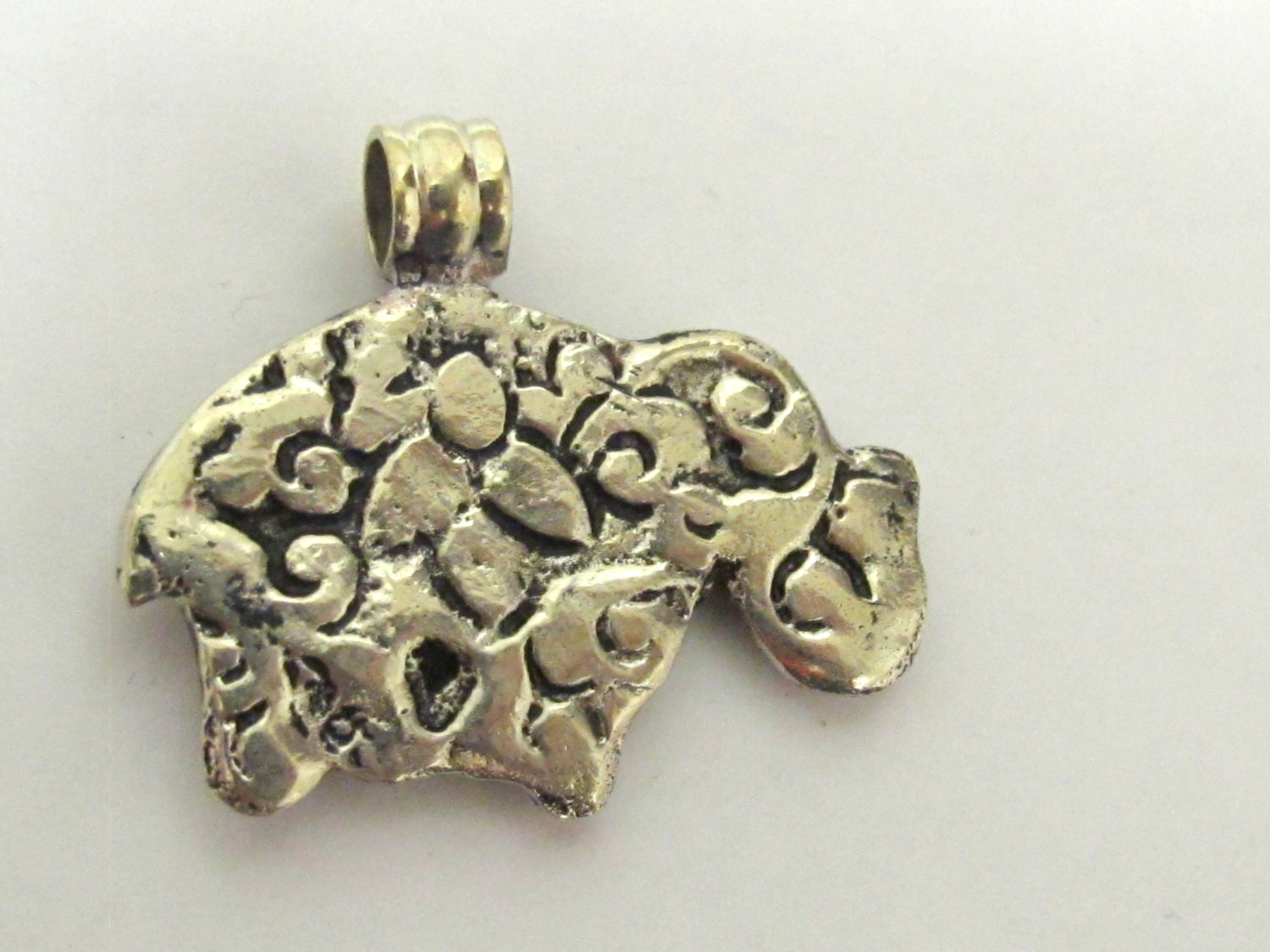 Small Elephant shape reversible Tibetan repousse pendant with turquoise inlay - PM254B