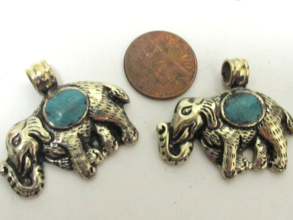 Small Elephant shape reversible Tibetan repousse pendant with turquoise inlay - PM254B