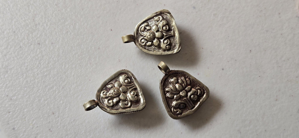 Tibetan antiqued silver color encased turquoise howlite happy Buddha face focal pendant floral carving - PM001A